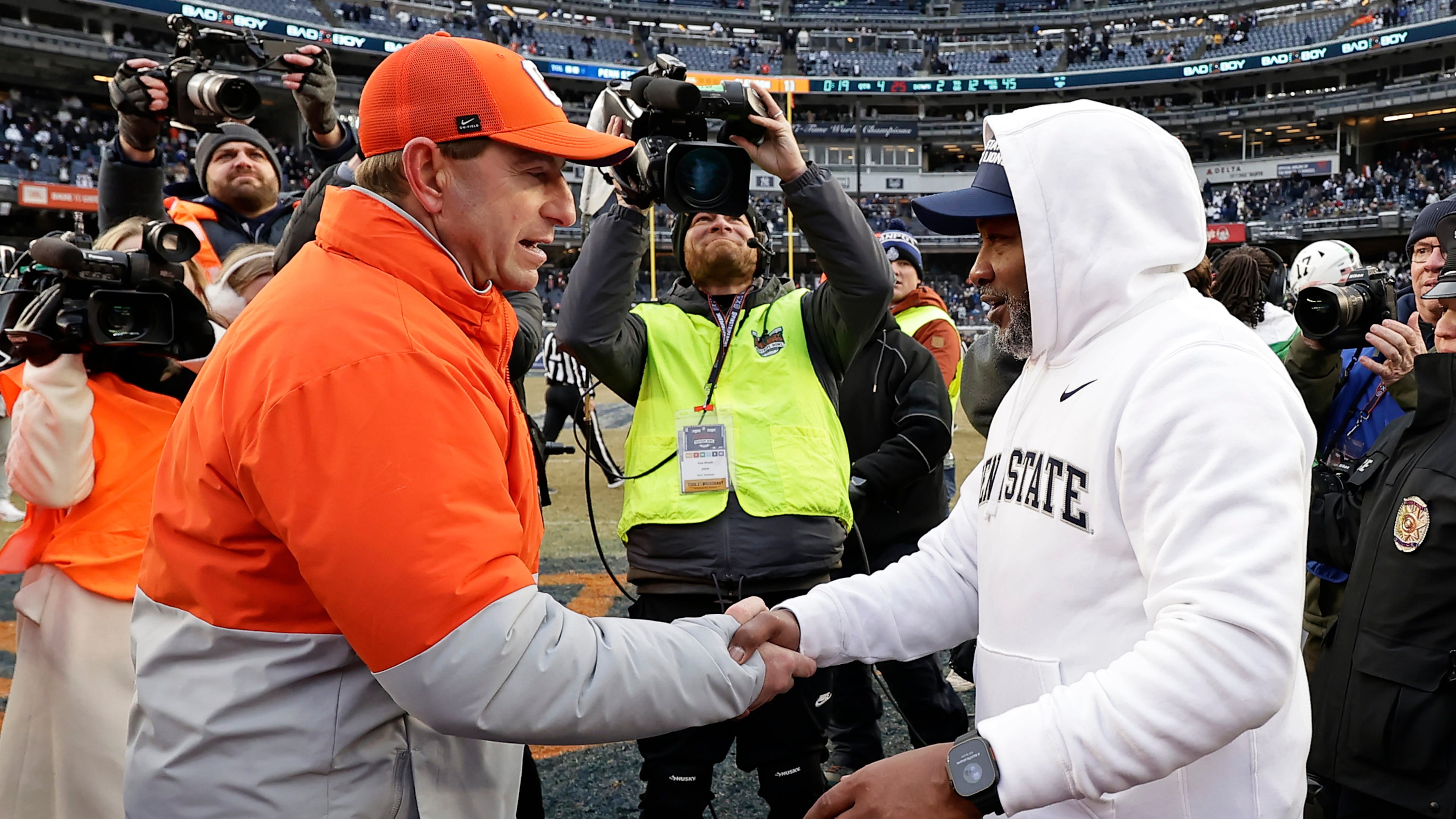 Penn State interim head coach Terry Smith, right, shakes ands with Clemson head coach Dabo Swinney after the Pinstripe Bowl NCAA college football game at Yankee Stadium, Saturday, Dec. 27, 2025, in New York. (AP Photo/Adam Hunger)