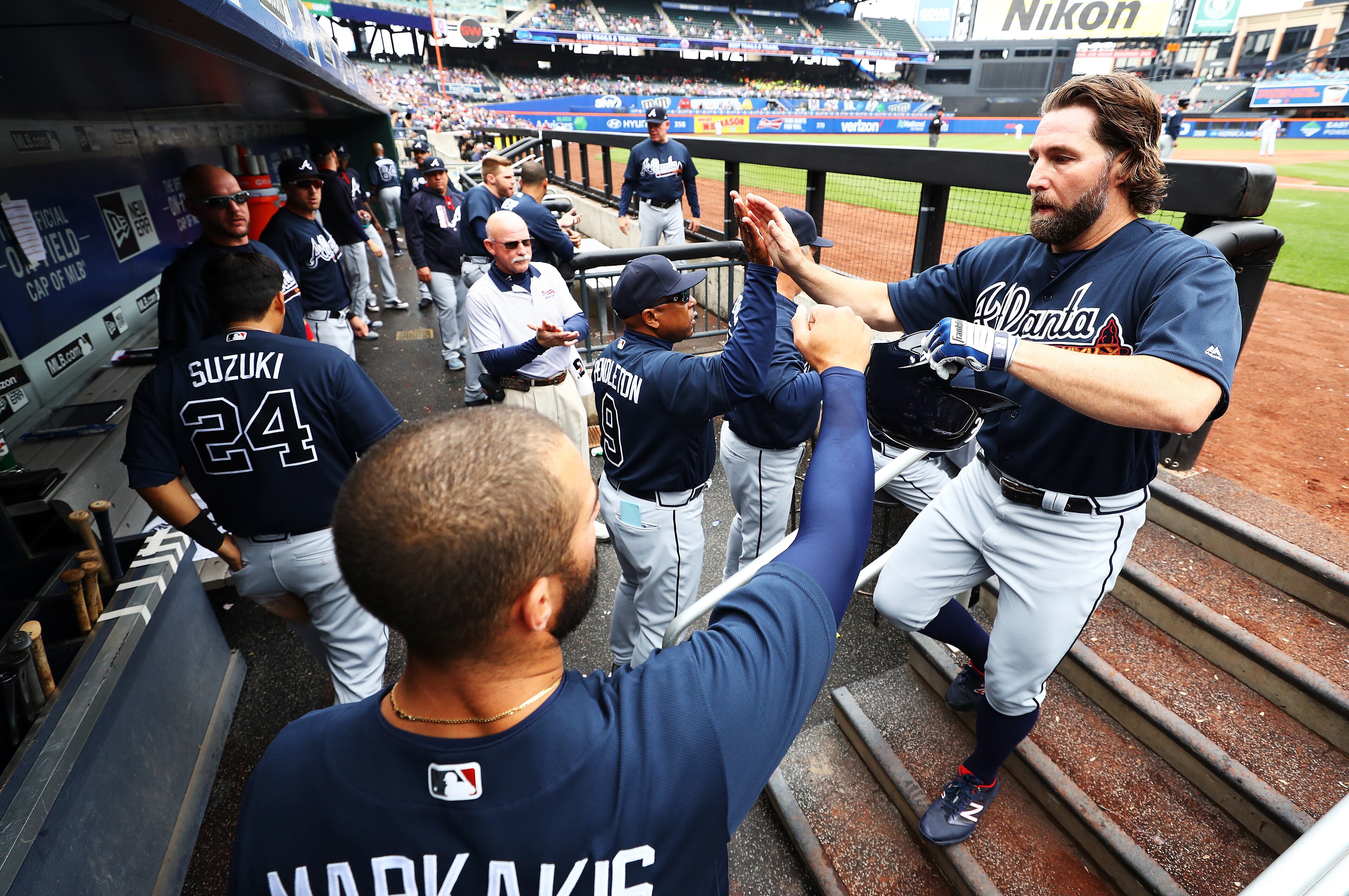 NEW YORK, NY - APRIL 27: R.A. Dickey #19 of the Atlanta Braves celebrates driving in a run against the New York Mets in the second inning during their game at Citi Field on April 27, 2017 in New York City. (Photo by Al Bello/Getty Images)