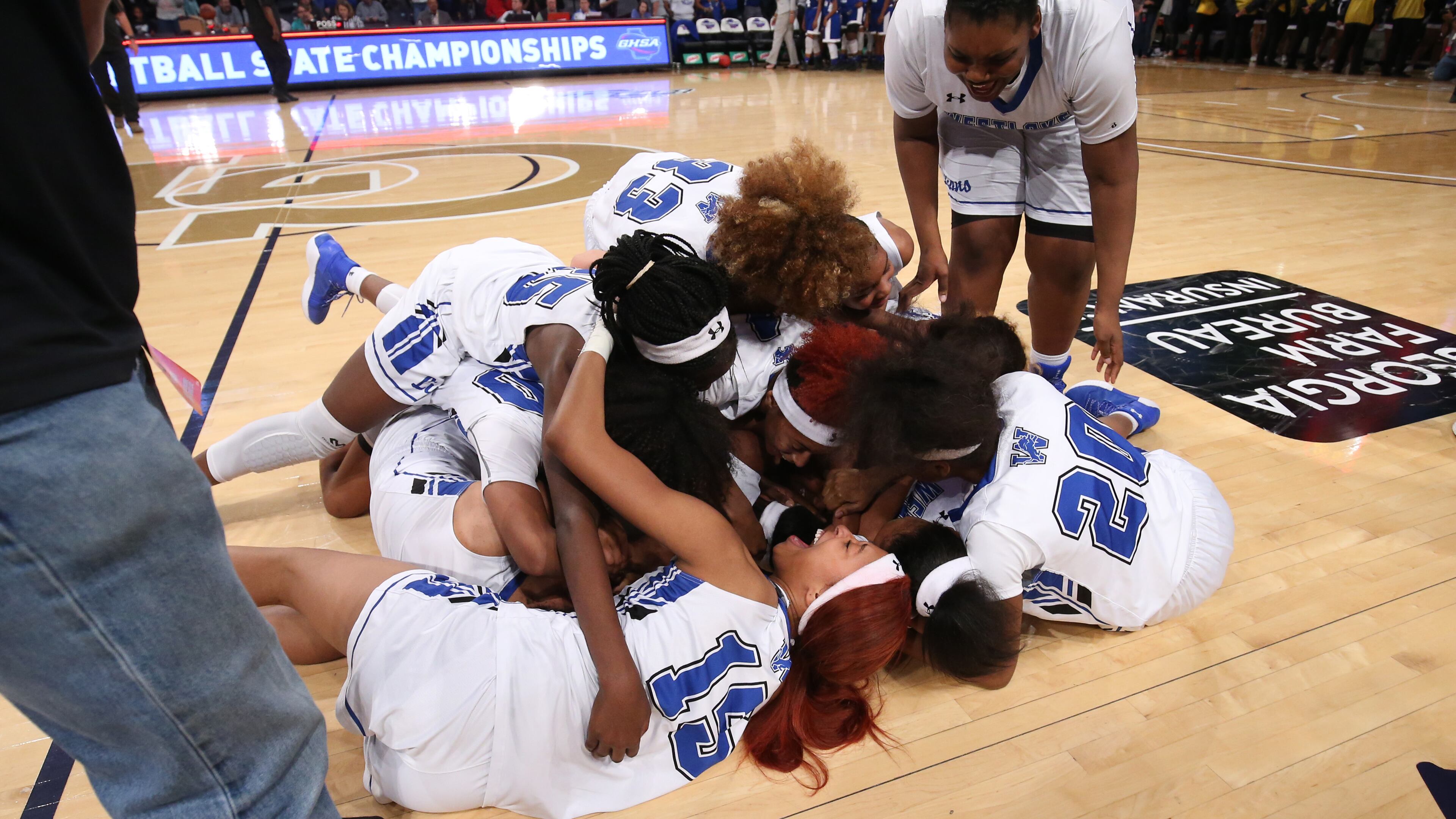 March 10, 2018 - Atlanta, Ga: Westlake players celebrate their win against Newton in the GHSA Class AAAAAAA Girls State Championship at McCamish Pavilion Saturday, March 10, 2018, in Atlanta. Westlake won 60-45. PHOTO / JASON GETZ