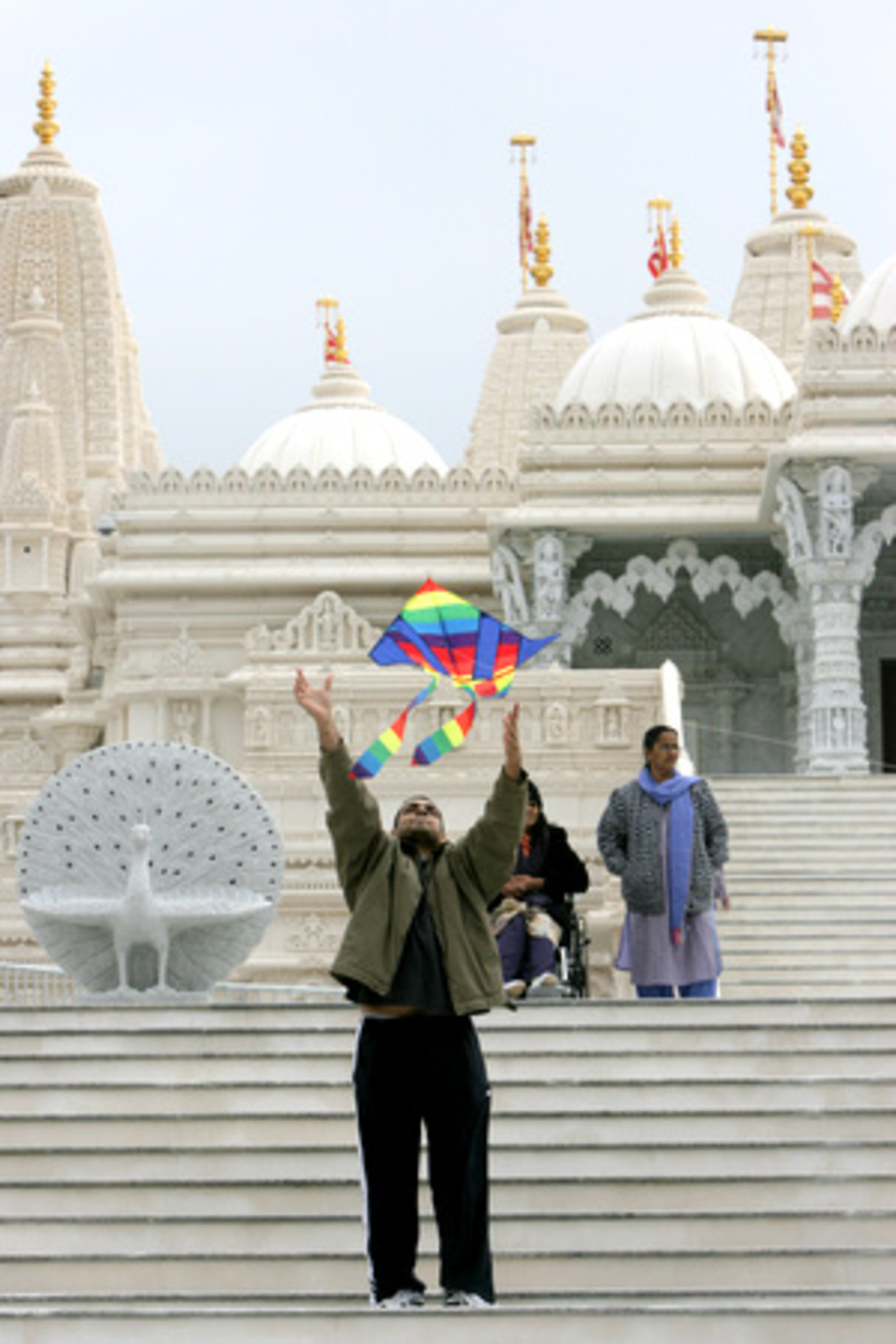 Lava Jaryarama of Marietta took to the steps of the BAPS Shri Swaminarayan Mandir (Hindu Temple) in Lilburn of get his family's kite aloft.