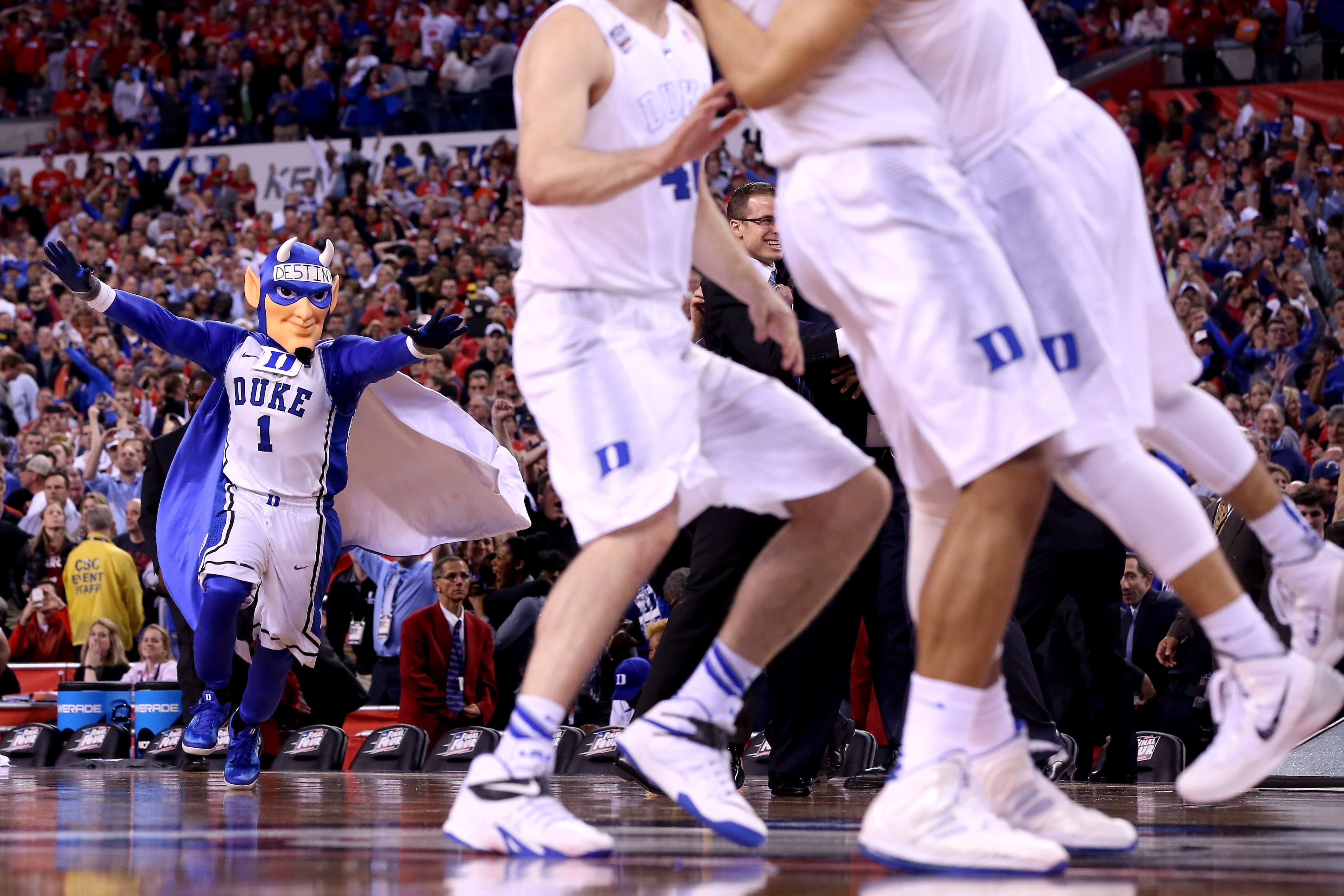 INDIANAPOLIS, IN - APRIL 06: The Duke Blue Devils celebrate as their mascot runs on the floor after defeating the Wisconsin Badgers during the NCAA Men's Final Four National Championship at Lucas Oil Stadium on April 6, 2015 in Indianapolis, Indiana. Duke defeated Wisconsin 68-63. (Photo by Streeter Lecka/Getty Images)