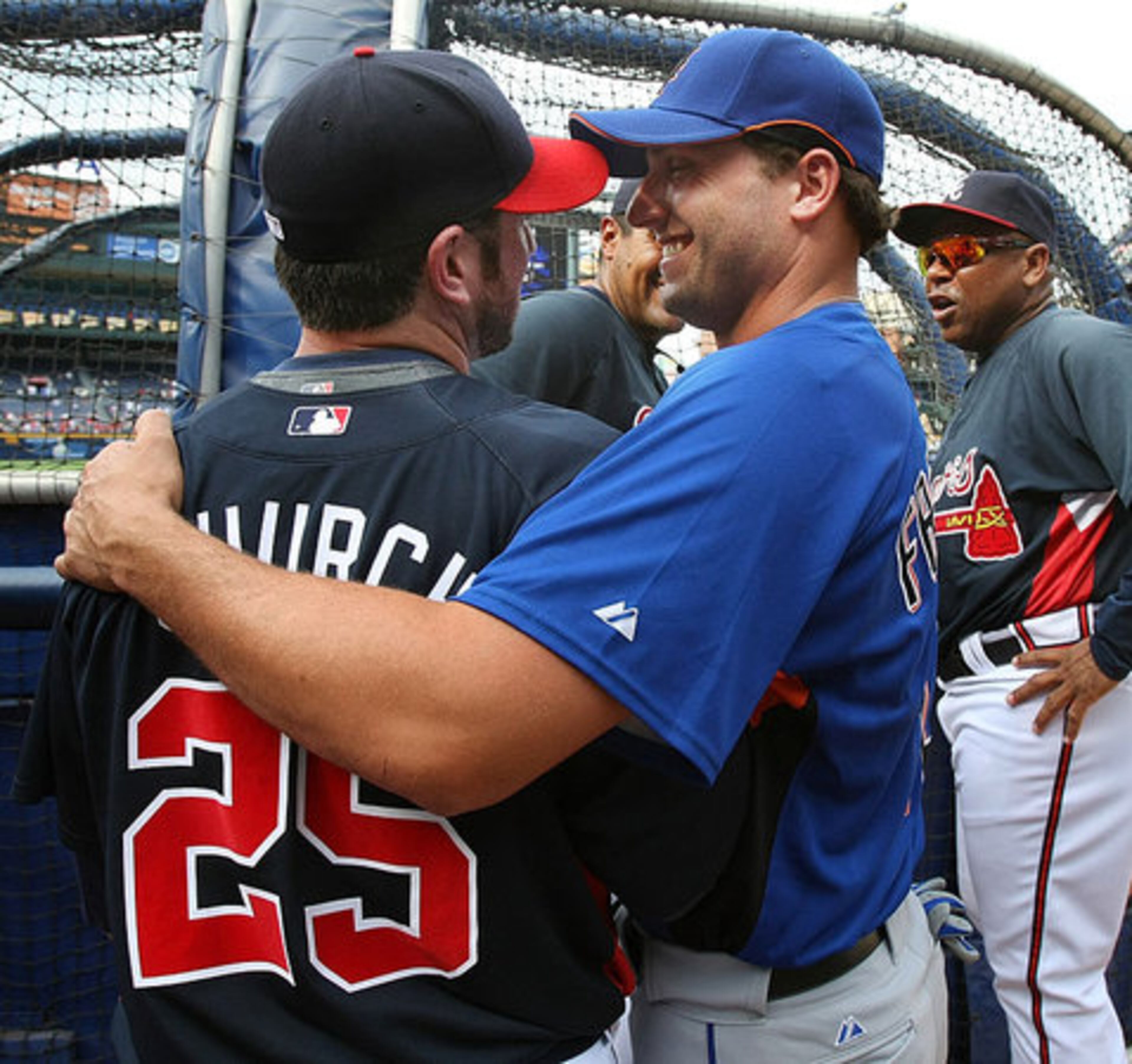 Francoeur greets Braves outfielder Ryan Church, who was exchanged for Francoeur, during batting practice before the game.