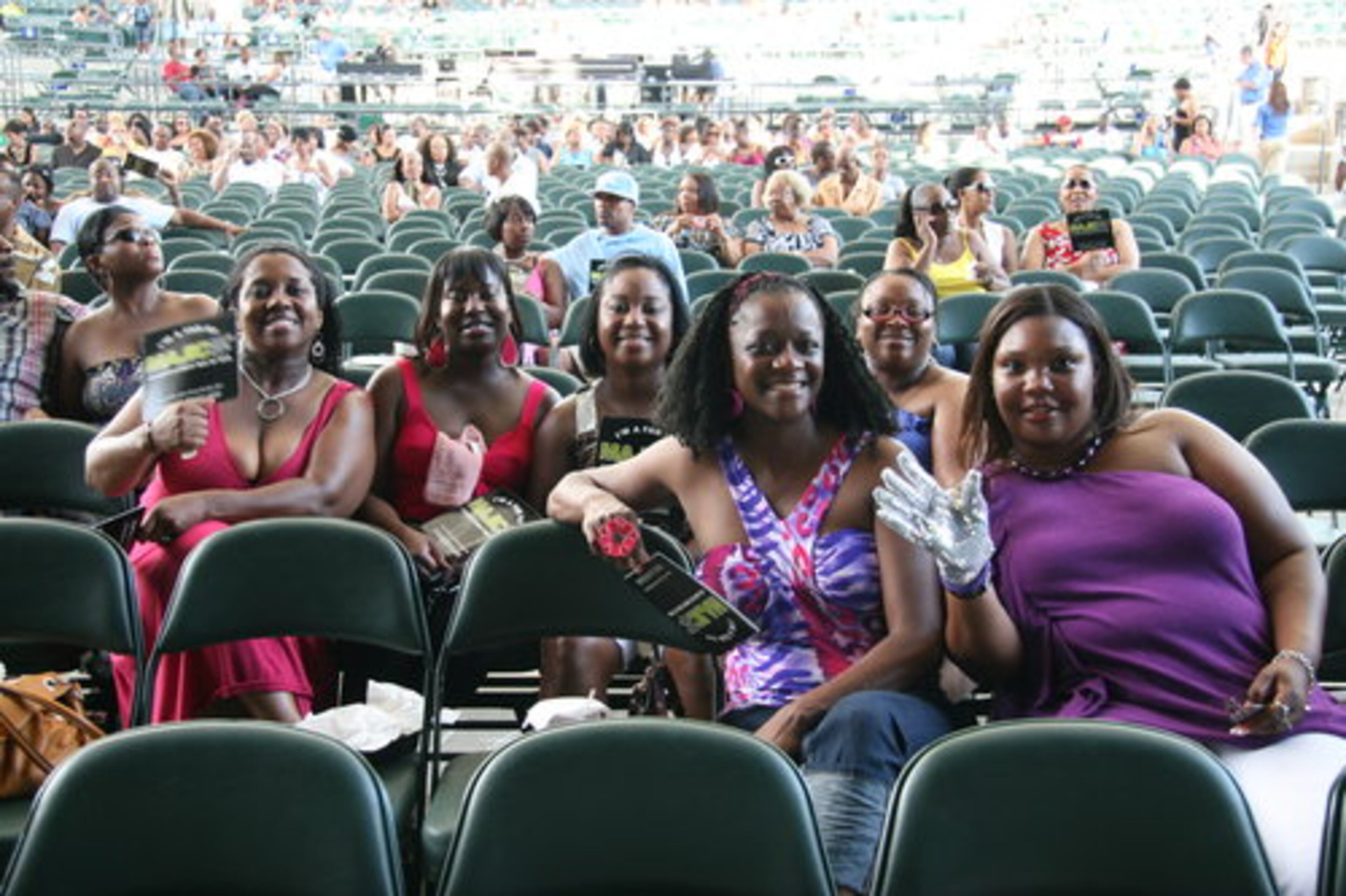 (From left to right back row) Dionna Shavers, Tamica Greer, Latoya Logan, Tammy Triplett, (front row) Angel White and Tamara Pittman endured the heat as they waited for the show to begin. Pittman wore a single white glove to commemorate Michael Jackson.