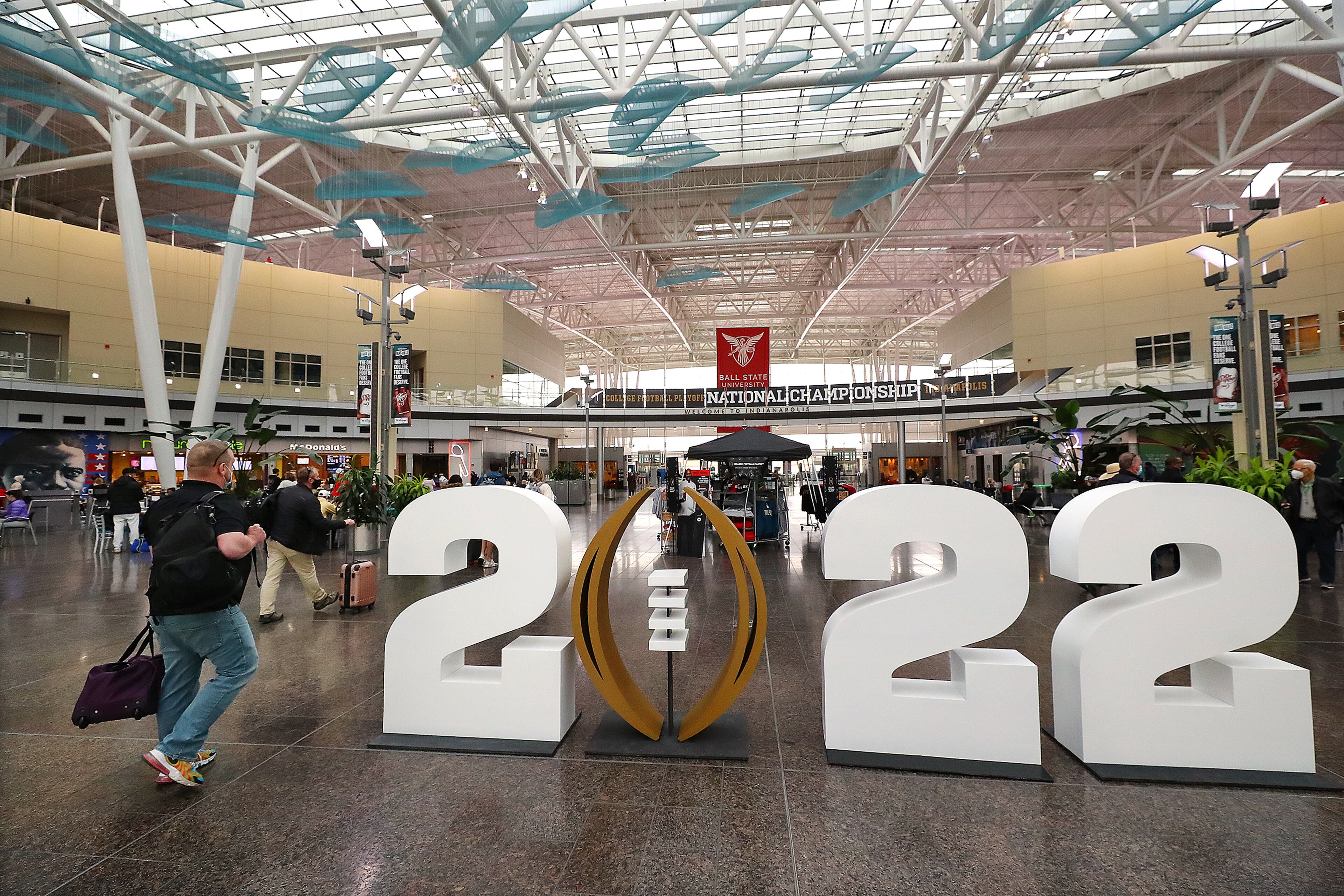 010622 Indianapolis: A display in the lobby of the Indianopolis International Airport welcomes football fans as they arrive for the national championship game on Thursday, Jan. 6, 2022, in Indianapolis. “Curtis Compton / Curtis.Compton@ajc.com”`