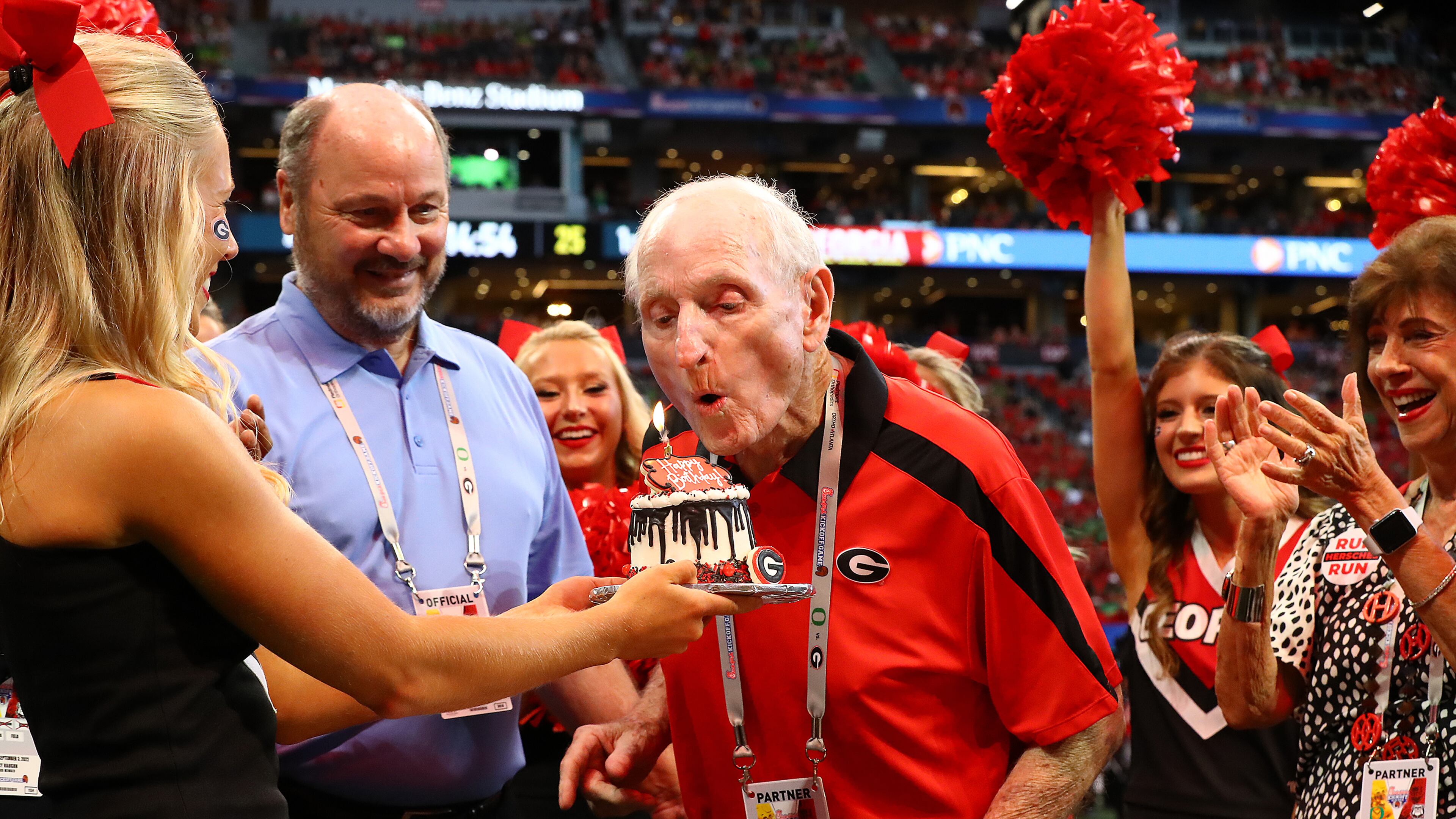 Former Georgia head coach Vince Dooley blows out his candle getting a surprise birthday celebration before kickoff against Oregon in a NCAA college football game on Saturday, Sept. 3, 2022, in Atlanta. Curtis Compton / Curtis Compton@ajc.com