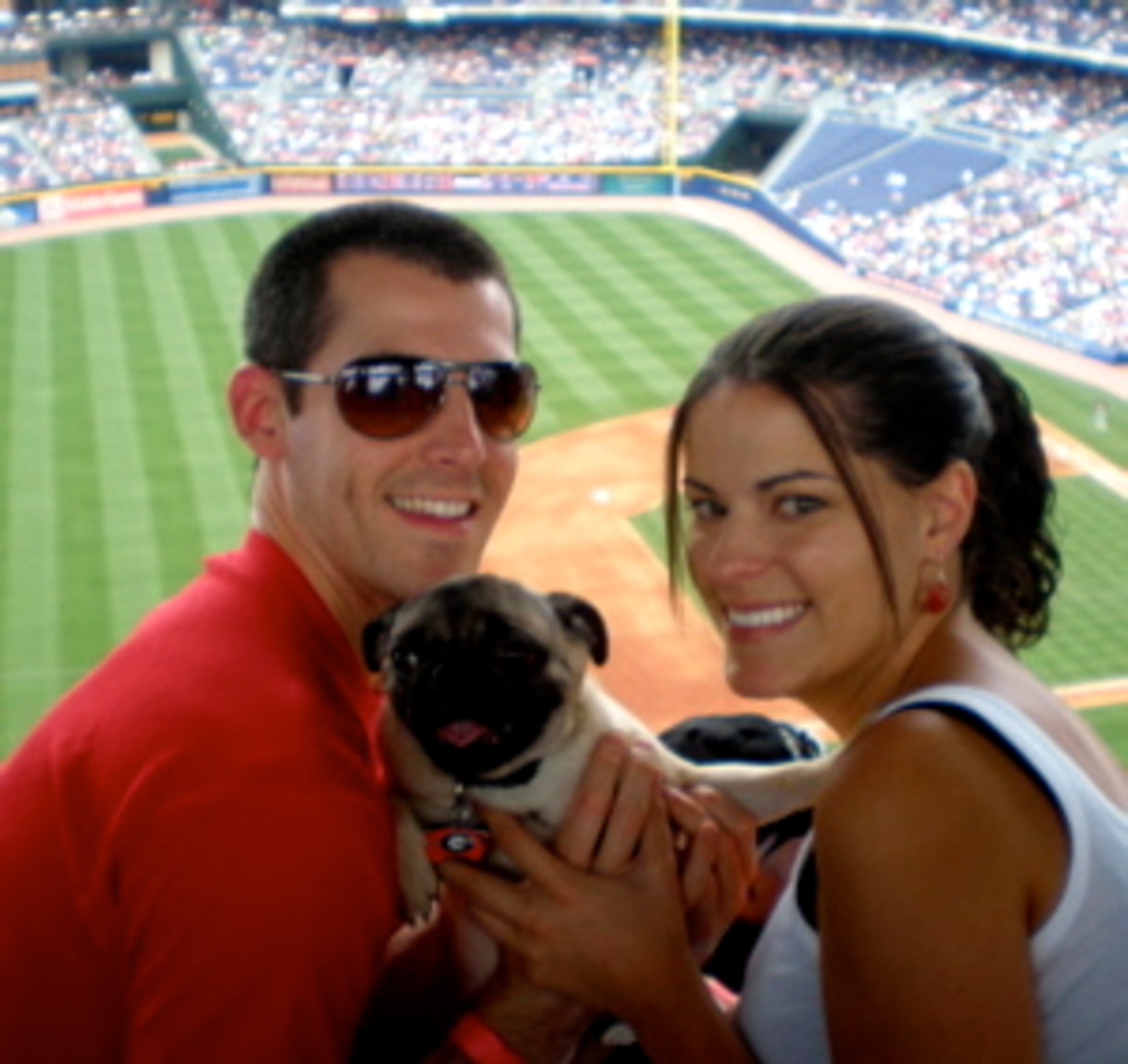 Brandon Meier, Cookie the Pug, and Becky Vaughn enjoy their first Bark at the Park