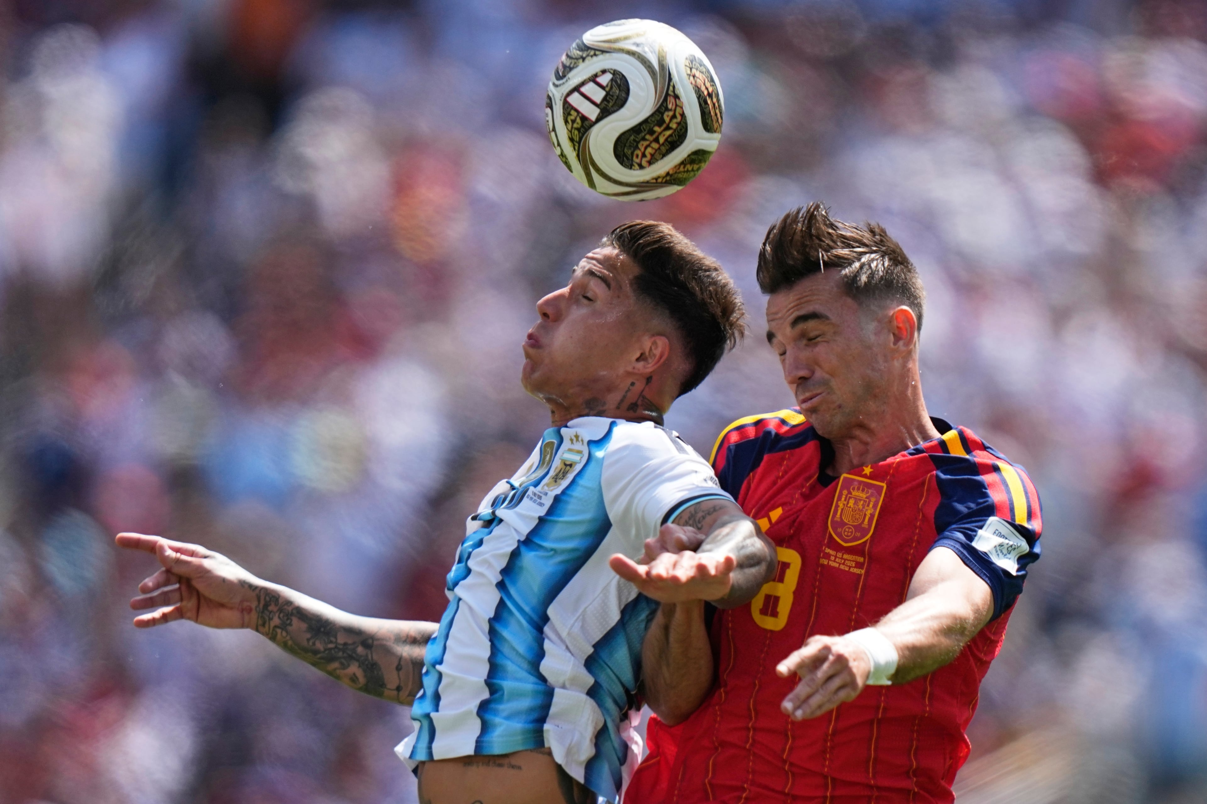 Argentina's Enzo Fernandez (left) and Spain's Fabian Ruiz (right) go for a header during the World Cup final soccer match between Spain and Argentina in East Rutherford, N.J., near New York, Sunday, July 19, 2026. (Frank Franklin II/AP)