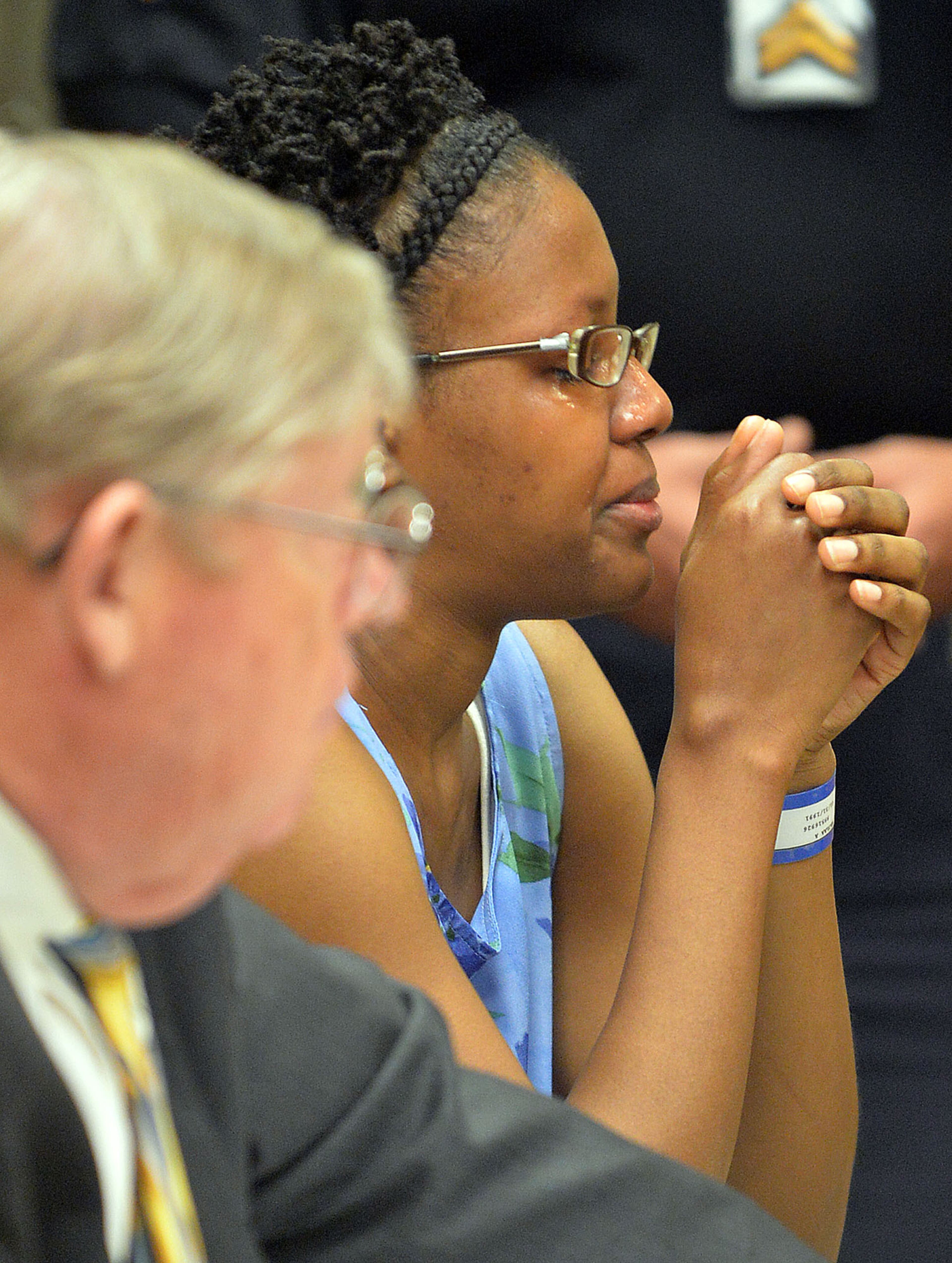 Najlaa Mcintosh becomes emotional during testimony by GCPD Detective James Sweeney. Chief Magistrate Kristina Hammer Blum presides over hearing for a Gwinnett man and his daughter who are charged with starving the man's child to death and withholding food from the child's 21-year-old mother, who weighed 59 pounds when she was found. Calvin Mcintosh and his daughter, Najlaa, appear in the probable cause hearing Friday, December 5, 2014. Judge Blum found there was probably cause for cruelty to children and murder charges and bound their case over to Superior Court. She said that due to the charges, the court did not have jurisdiction to set a bond. KENT D. JOHNSON/KDJOHNSON@AJC.COM