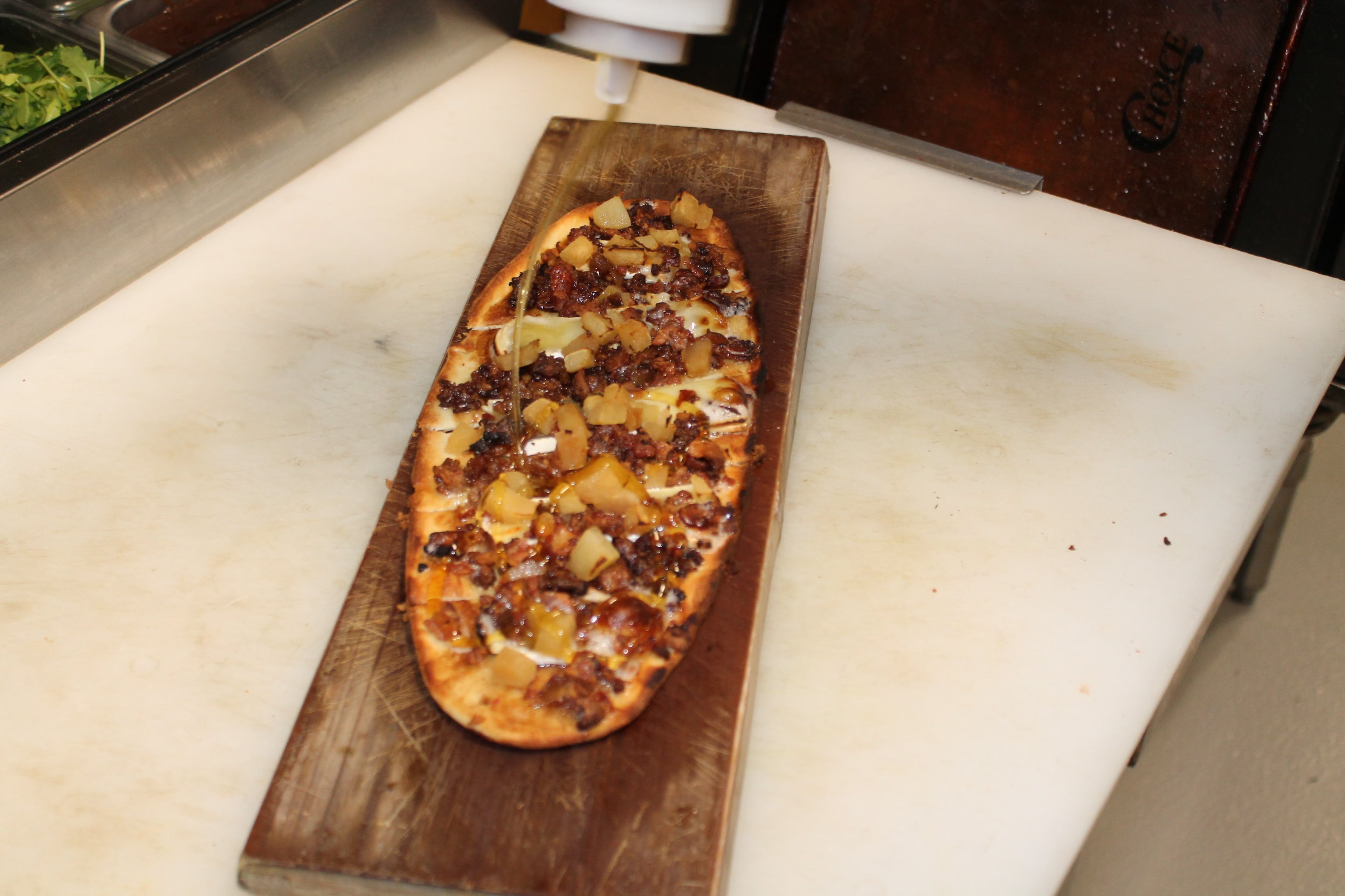 Granny Smith apples and crispy bacon top a flatbread built for fall at Dunwoody's Bar{n} Booze {n} Bites.
(Courtesy of Bar{n} Booze {n} Bites)