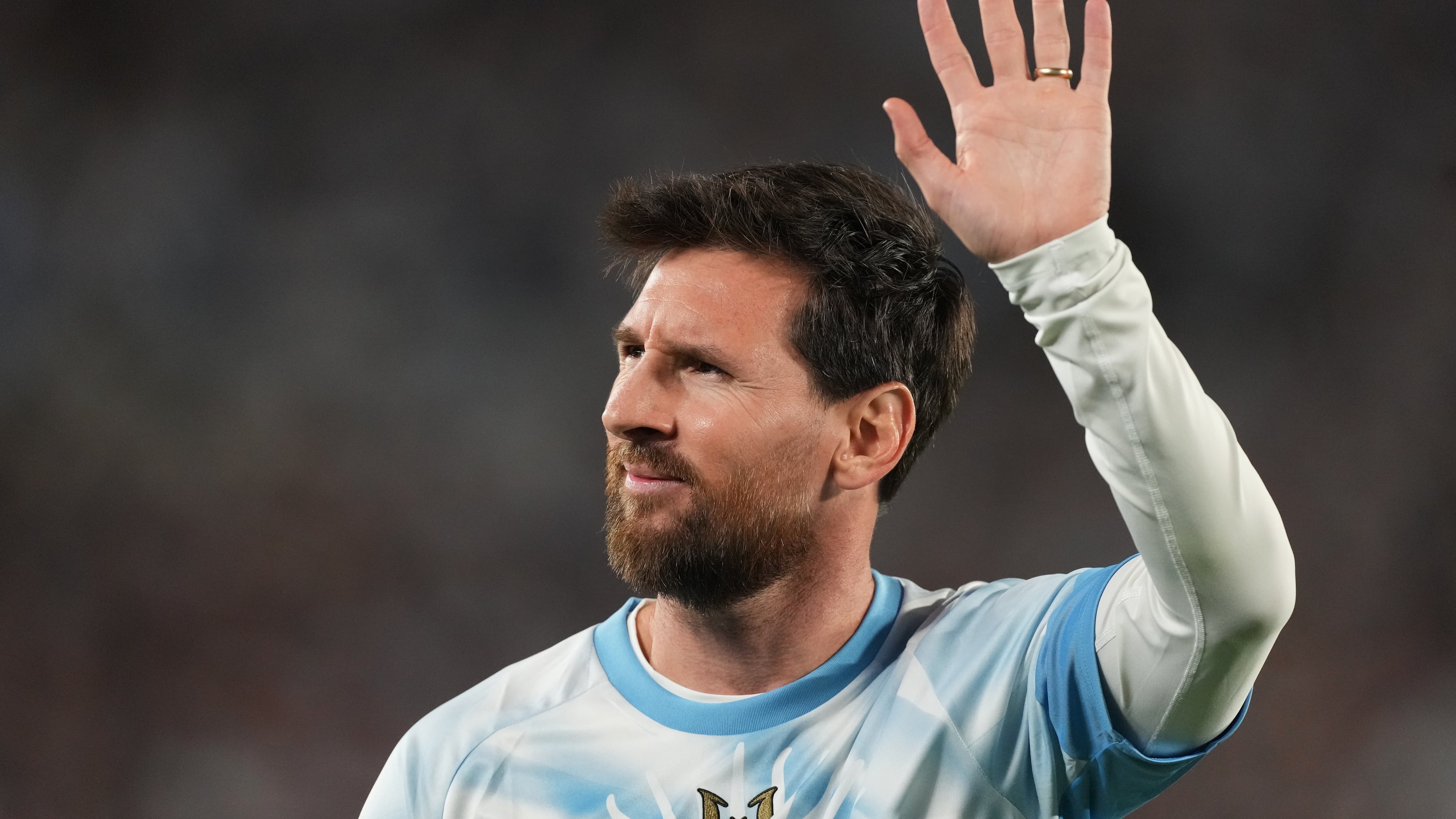 Argentina's Lionel Messi waves to fans before an international friendly soccer match against Benin, marking his farewell appearance for the national team, in Buenos Aires, Argentina, Tuesday, Oct.6, 2026. (AP Photo/Gustavo Garello)