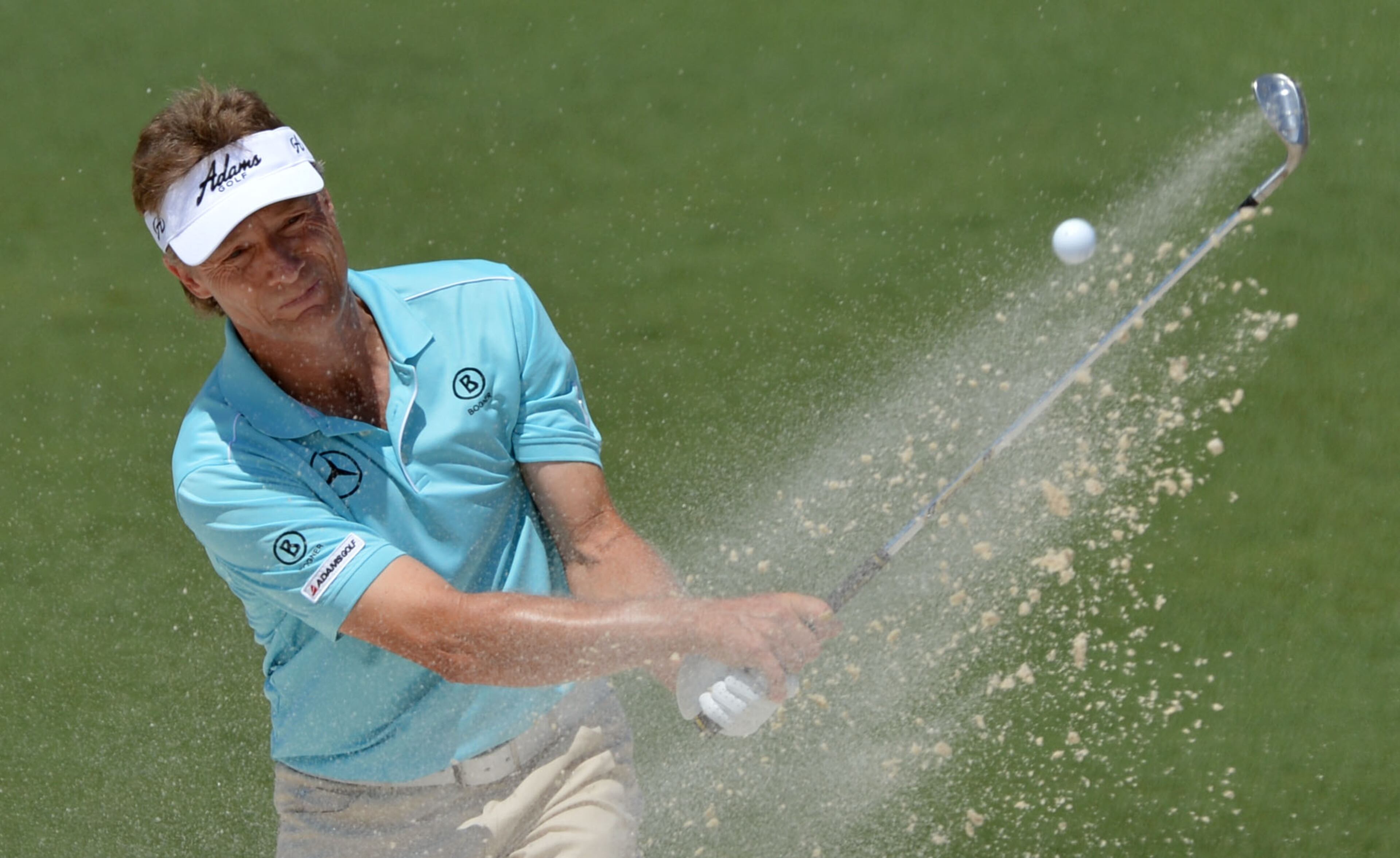 Bernhard Langer of Germany hits from the bunker on #2 during the third round of the Masters Tournament Saturday, April 12, 2014, at Augusta National Golf Club.