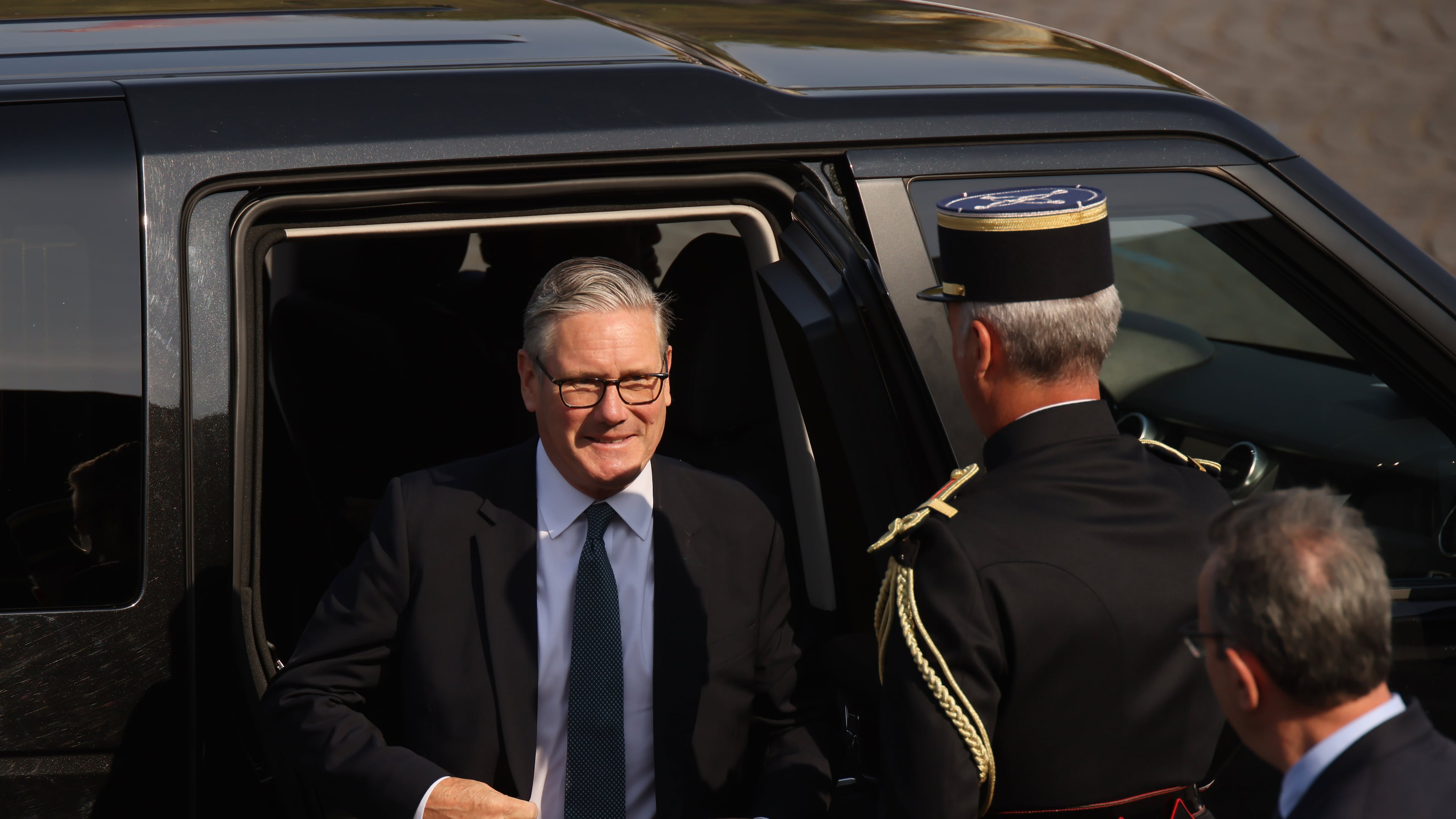 British Prime Minister Keir Starmer arrives for the Bastille Day military parade on the Champs-Elysees avenue in Paris, Tuesday, July 14, 2026. (AP Photo/Thomas Padilla)