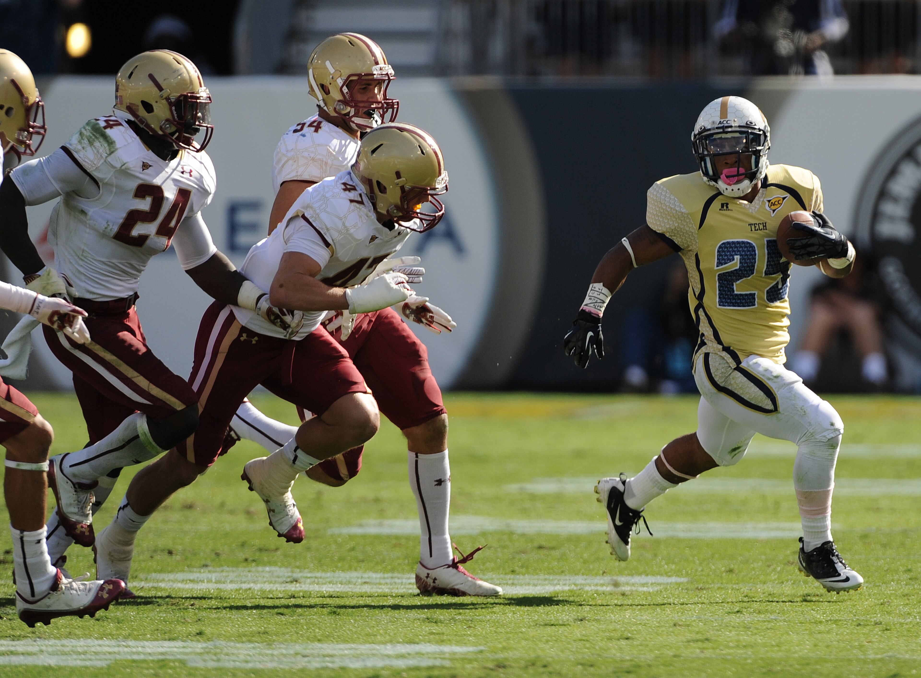 Tech's Robert Godhigh (25) runs away from the Boston College defense.