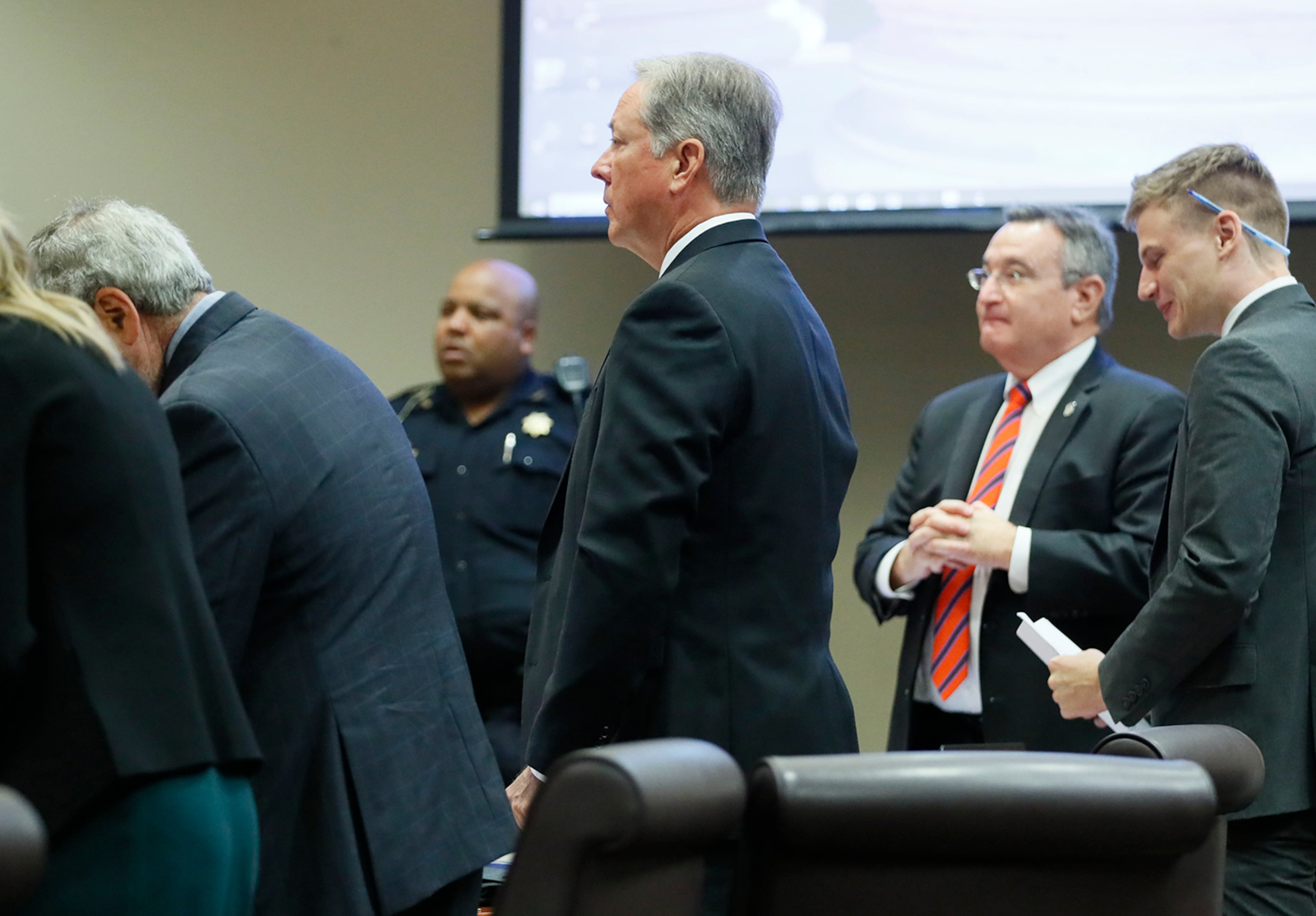 October 2, 2019 - Decatur - Former DeKalb County Police Officer Robert "Chip" Olsen (center) stands with his defense team including investigator Richard Hyde (right) and attorney Lukas Alfen, as the jury enters the courtroom. The murder trial of former DeKalb County Police Officer Robert "Chip" Olsen continued today. Olsen is charged with murdering war veteran Anthony Hill. Bob Andres / robert.andres@ajc.com