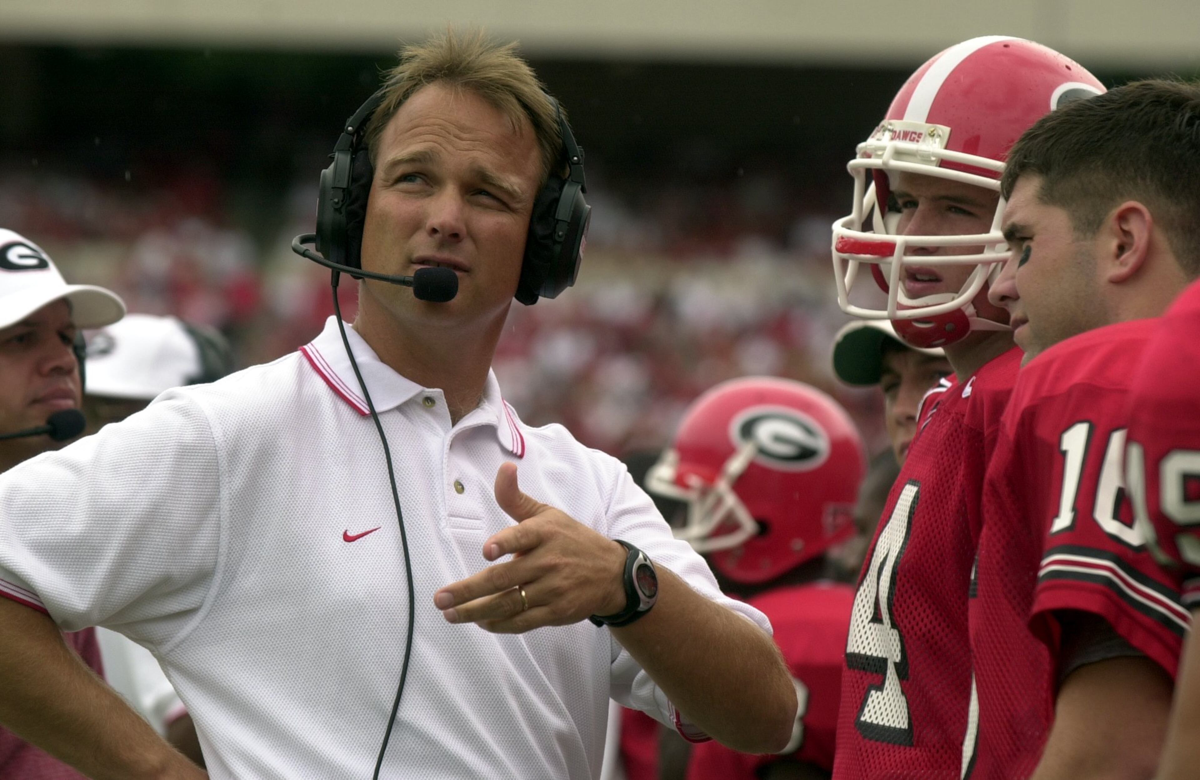 Richt and quarterbacks David Greene and Cory Phillips on the sideline of the 2001 opener, a 45-17 victory over Arkansas State.