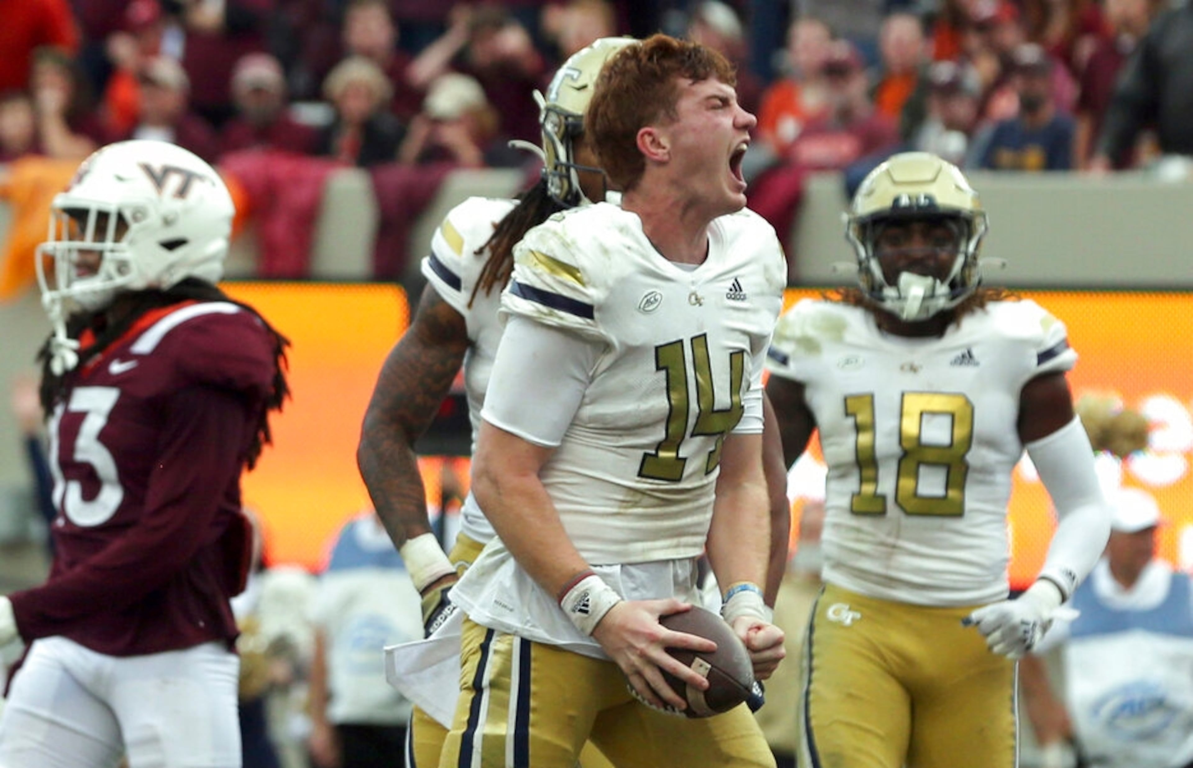 Georgia Tech quarterback Zach Pyron (14) celebrates a touchdown run in the second half of an NCAA college football game against Virginia Tech, Saturday, Nov. 5 2022, in Blacksburg, Va. Georgia Tech won 28-27. (Matt Gentry/The Roanoke Times via AP)