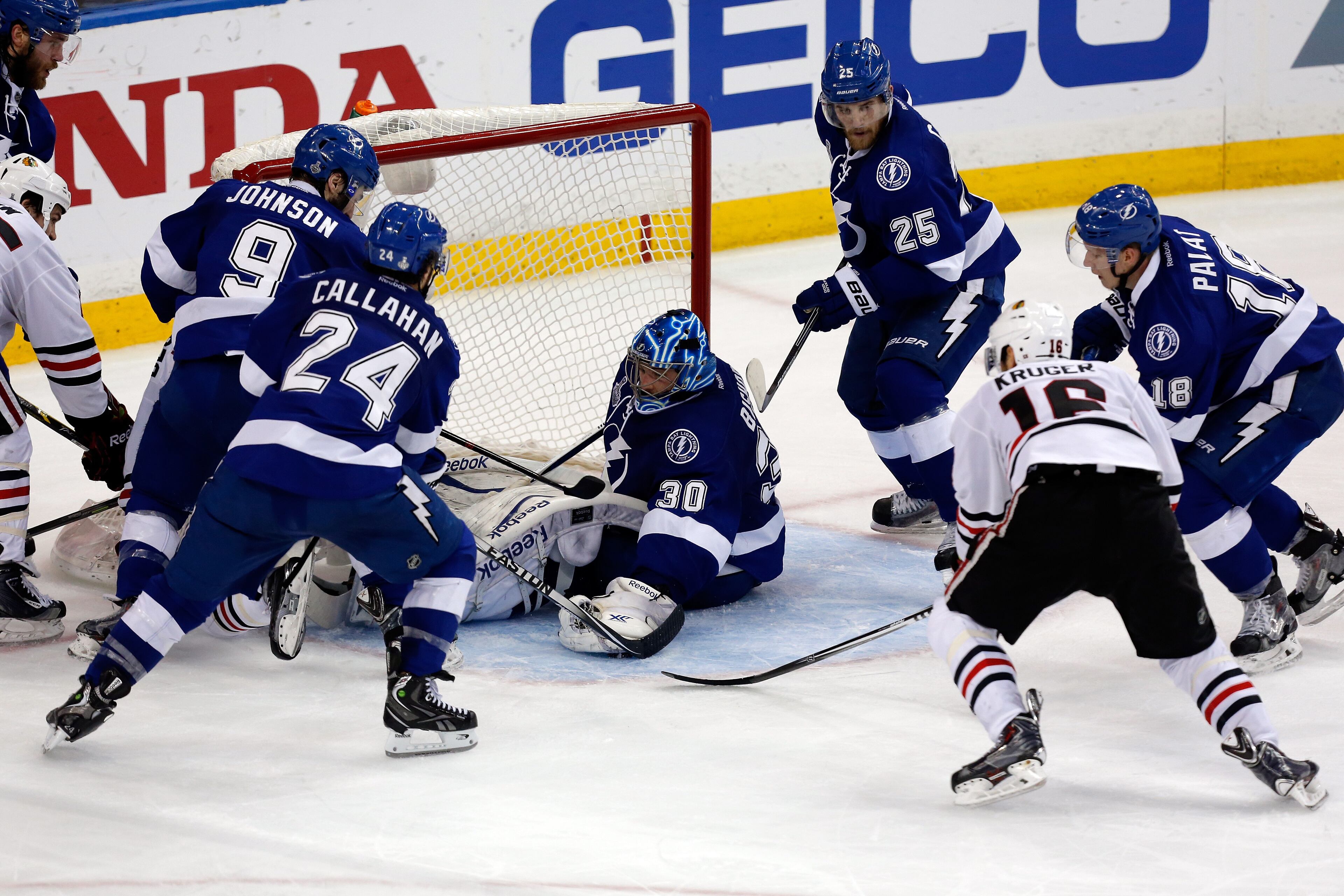 TAMPA, FL - JUNE 13: Ben Bishop #30 of the Tampa Bay Lightning makes a save in the third period against the Chicago Blackhawks during Game Five of the 2015 NHL Stanley Cup Final at Amalie Arena on June 13, 2015 in Tampa, Florida. (Photo by Mike Carlson/Getty Images)