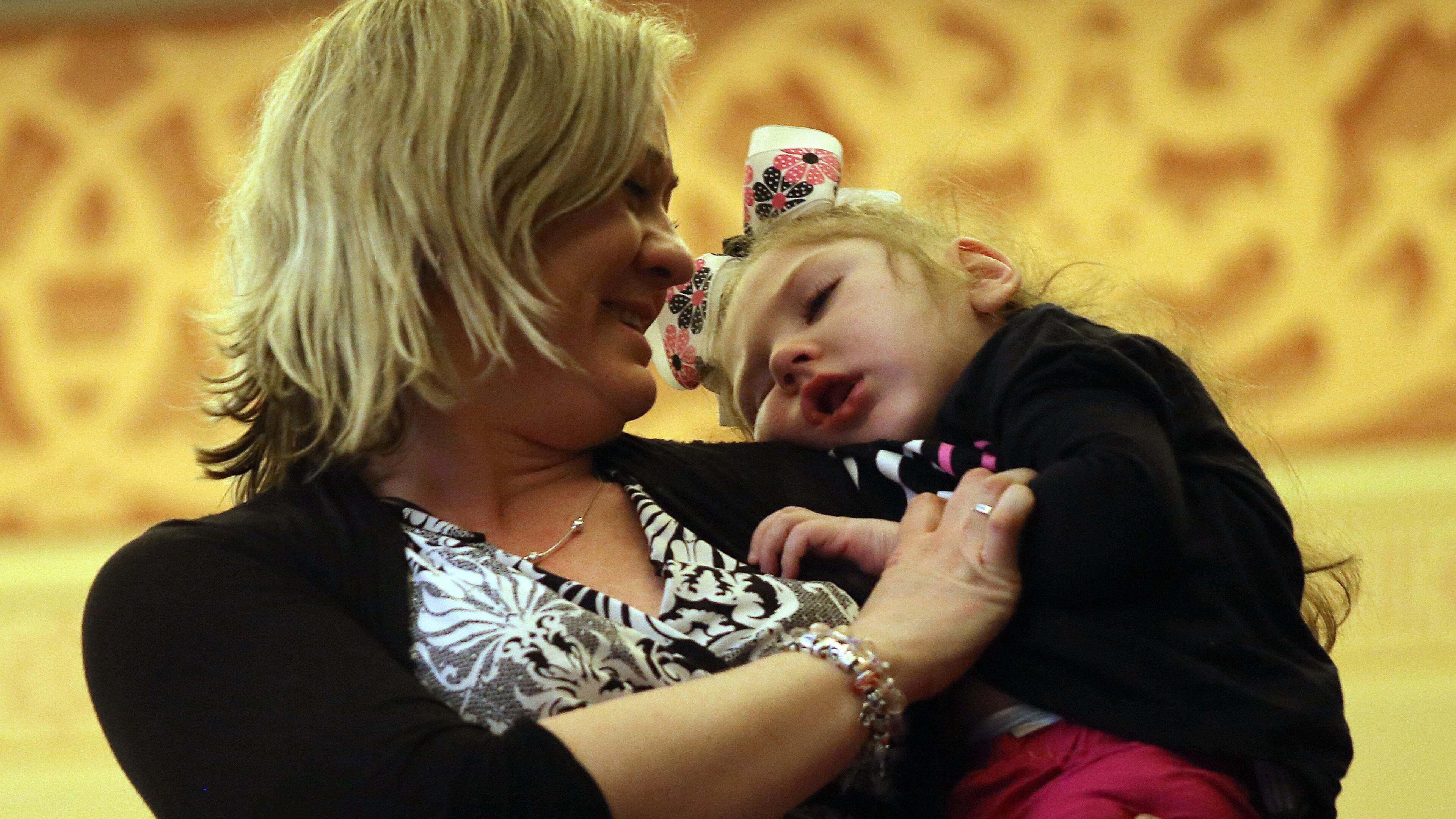 Janea Cox holds her daughter Haleigh in the House gallery as she is introduced Monday afternoon March 3, 2014 as the House takes up a medical marijuana bill that is named after Haleigh. The bill would allow the use of a certain type of oil derived from marijuana for the treatment of seizures such as the ones Haleigh has. The bill ultimately failed to pass as the Legislature adjourned for the 2014 session.
