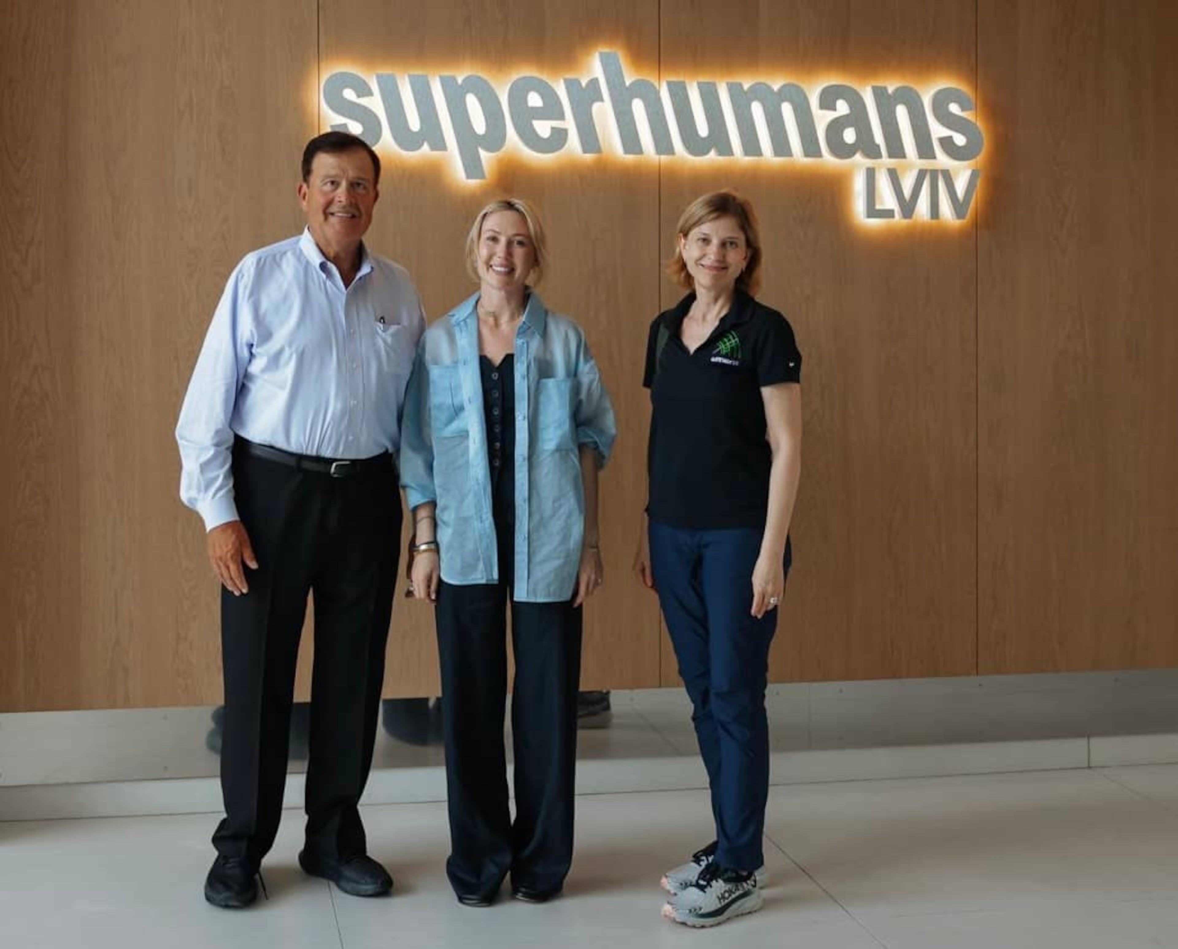 Emory Morsberger (left) and Olga Gorman (right) pose with a specialist at the Superhumans Center in Lviv, Ukraine. The organization now operates three centers in the European country. (Courtesy of Superhumans Center)