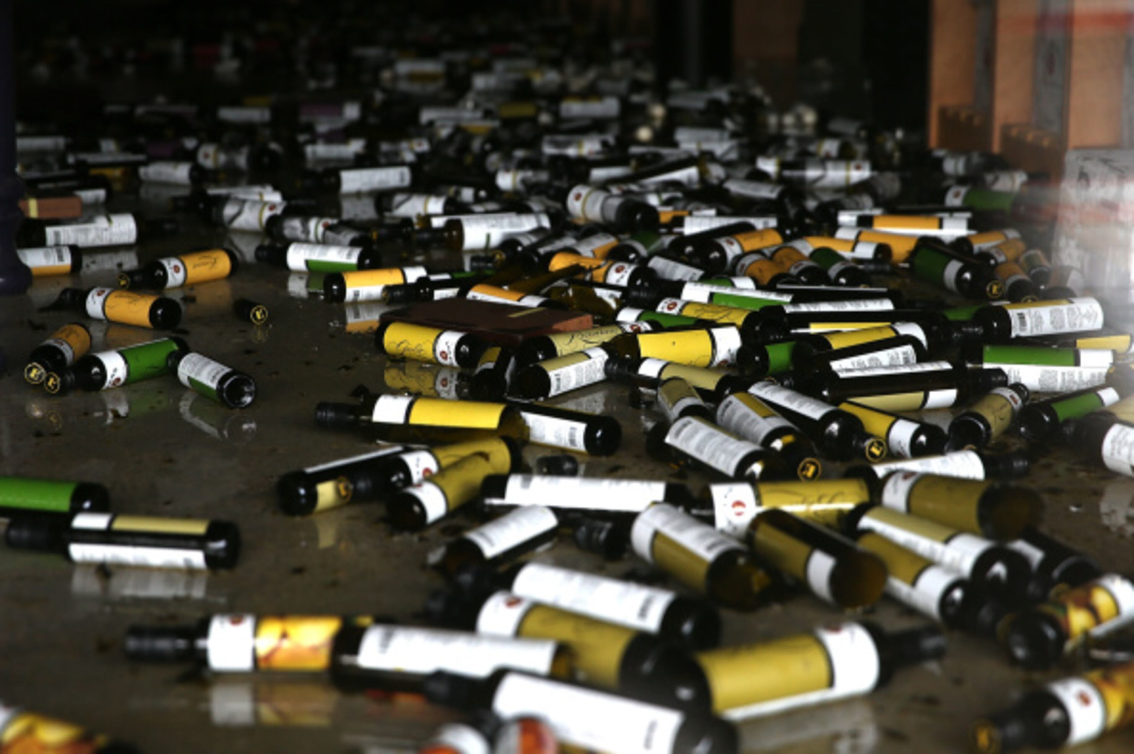 NAPA, CA - AUGUST 24: Bottles of olive oil and vinegar sit on the floor of a business damaged by a reported 6.0 earthquake on August 24, 2014 in Napa, California. A 6.0 earthquake rocked the San Francisco Bay Area shortly after 3:00 am on Sunday morning causing damage to buildings and sending at least 70 people to a hospital with non-life threatening injuries. (Photo by Justin Sullivan/Getty Images)