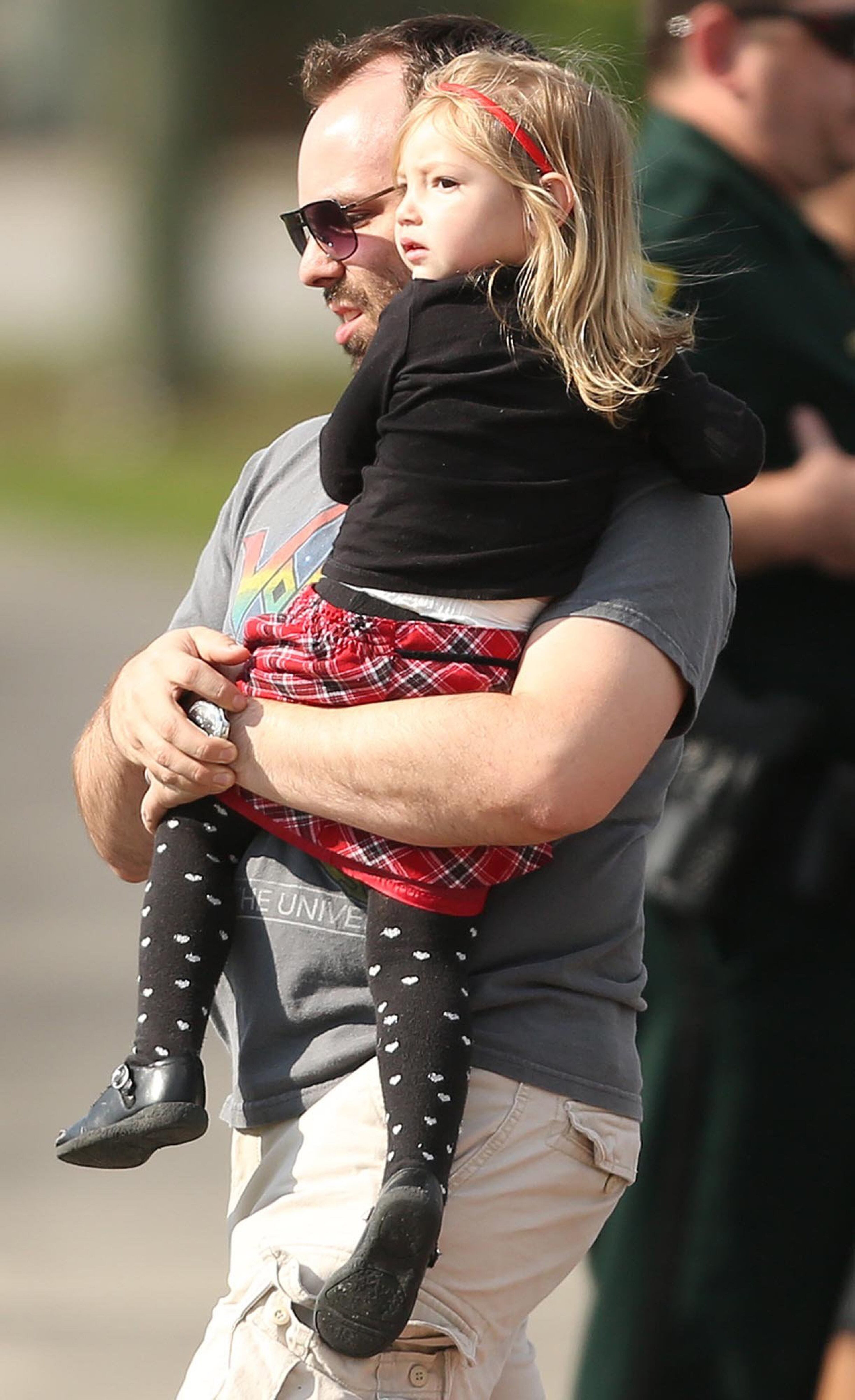 Children are escorted by their parents from the KinderCare Learning Center in Winter Park, Fla.. (Stephen M. Dowell, Orlando Sentinel/MCT)