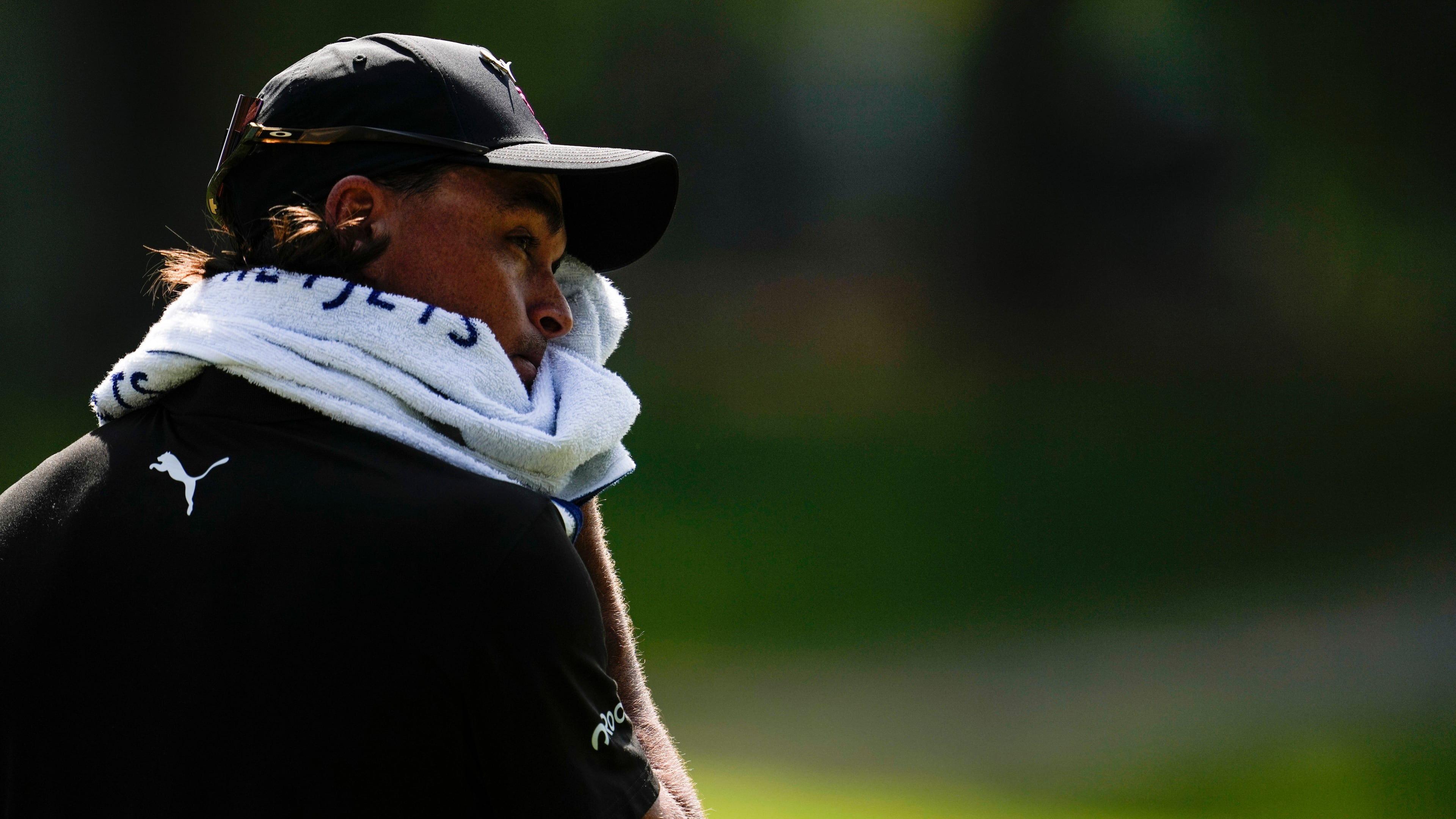 Rickie Fowler wipes his face in the heat off the fifth tee box during the first round of the St. Jude Championship golf tournament, Thursday, Aug. 13, 2026, in Memphis, Tenn. (AP Photo/George Walker IV)