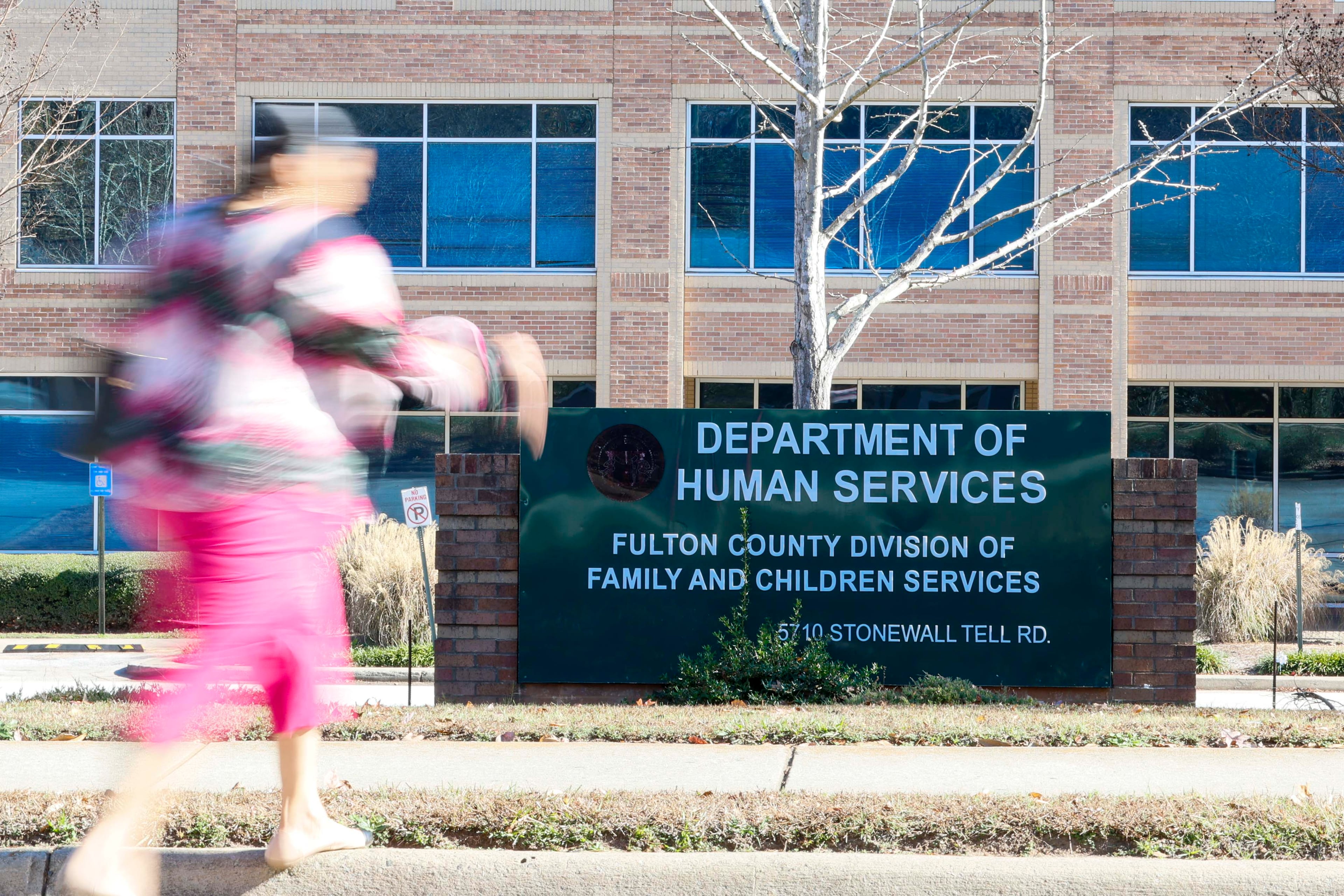 A person walks in front of the Department of Human Services, Division of Family & Children Services, South Fulton, on Sunday, Nov. 23, 2025. (Miguel Martinez/AJC)