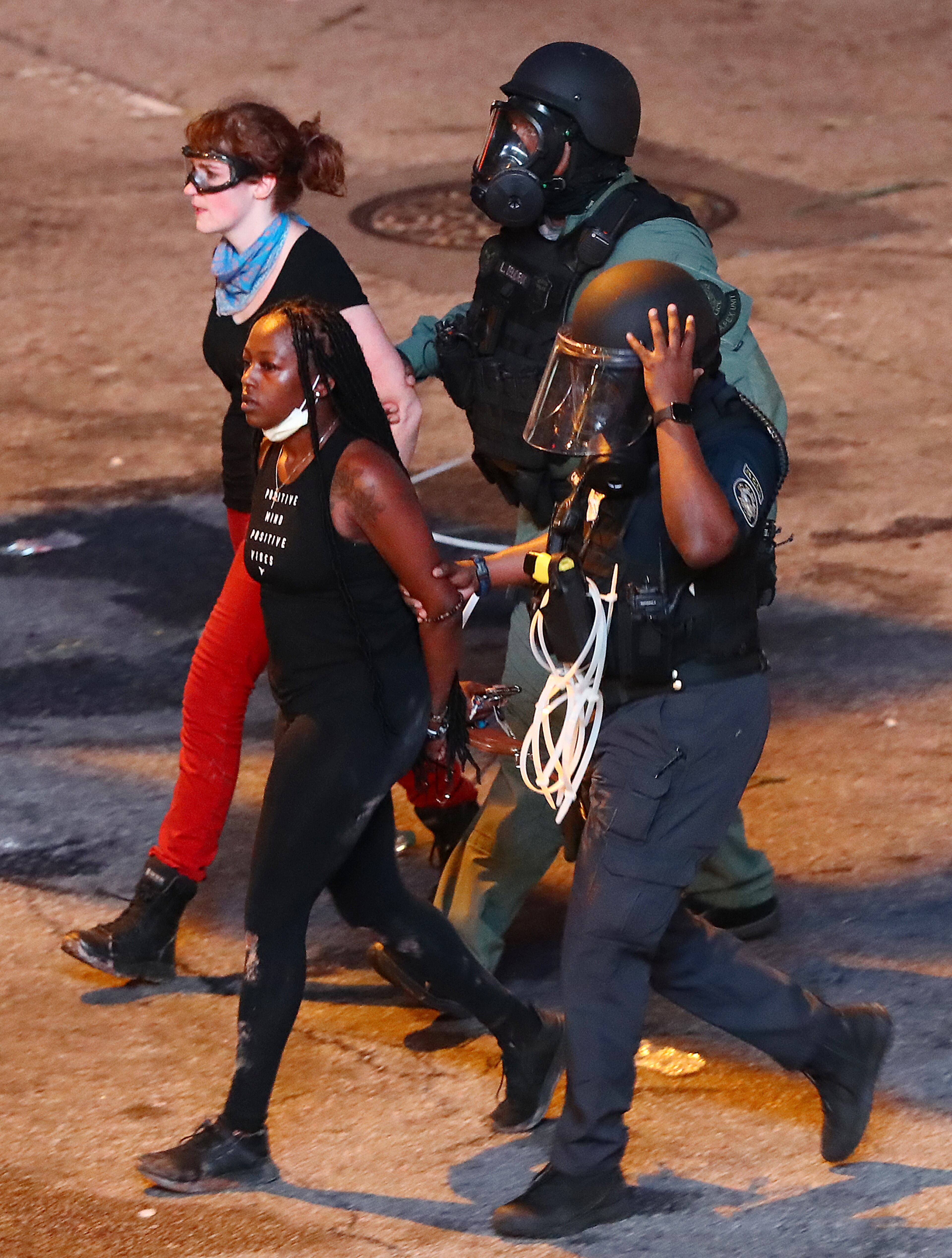 060220 Atlanta: Protesters are taken into custody by law enforcement officials after curfew during a fifth day of protests over the death of George Floyd on Tuesday, June 2, 2020, in Atlanta. Curtis Compton ccompton@ajc.com