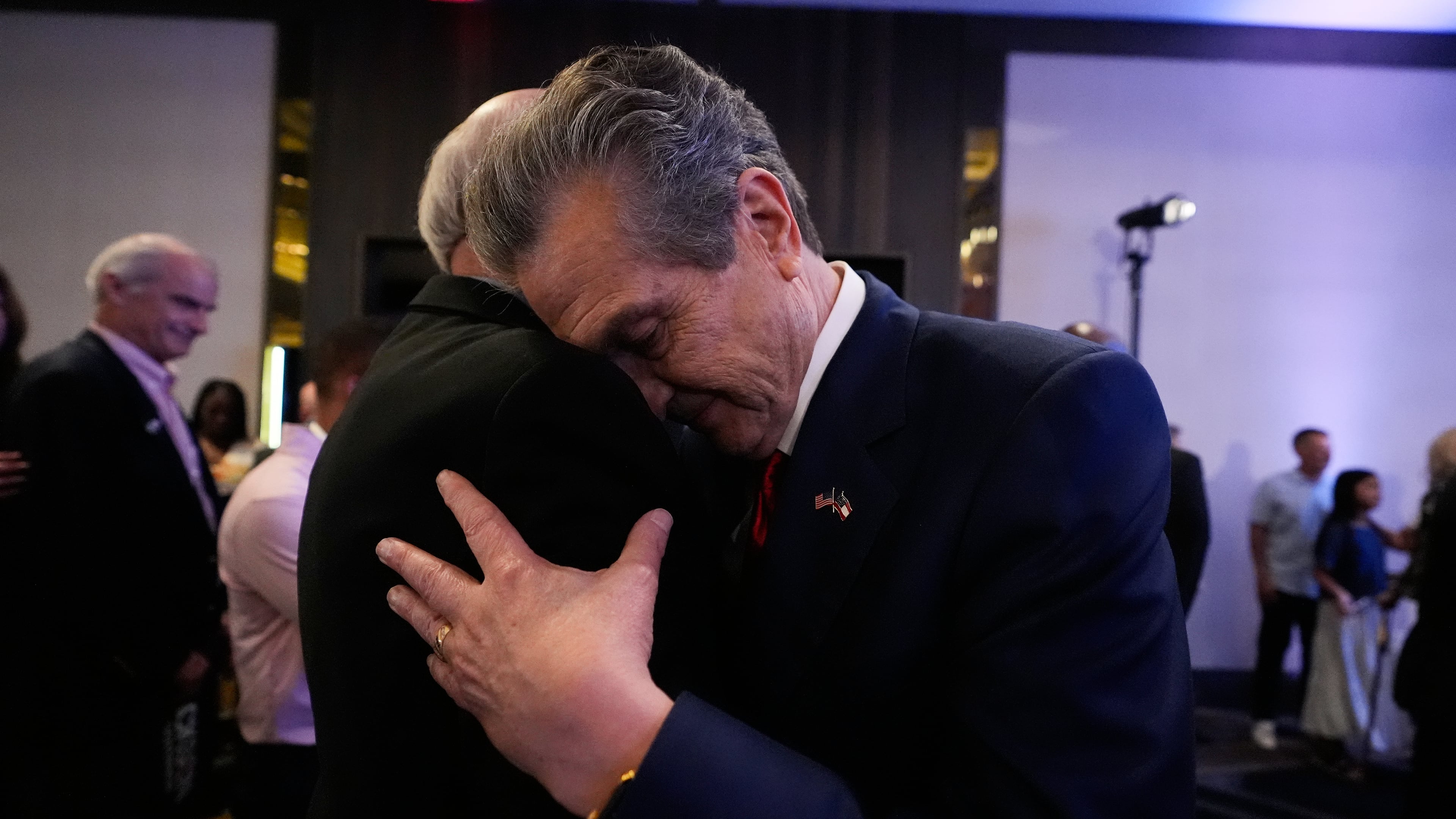 Georgia gubernatorial candidate Rick Jackson is hugged by a supporter after speaking during a primary election night party on Tuesday, May 19, 2026, in Atlanta. (AP Photo/Brynn Anderson)