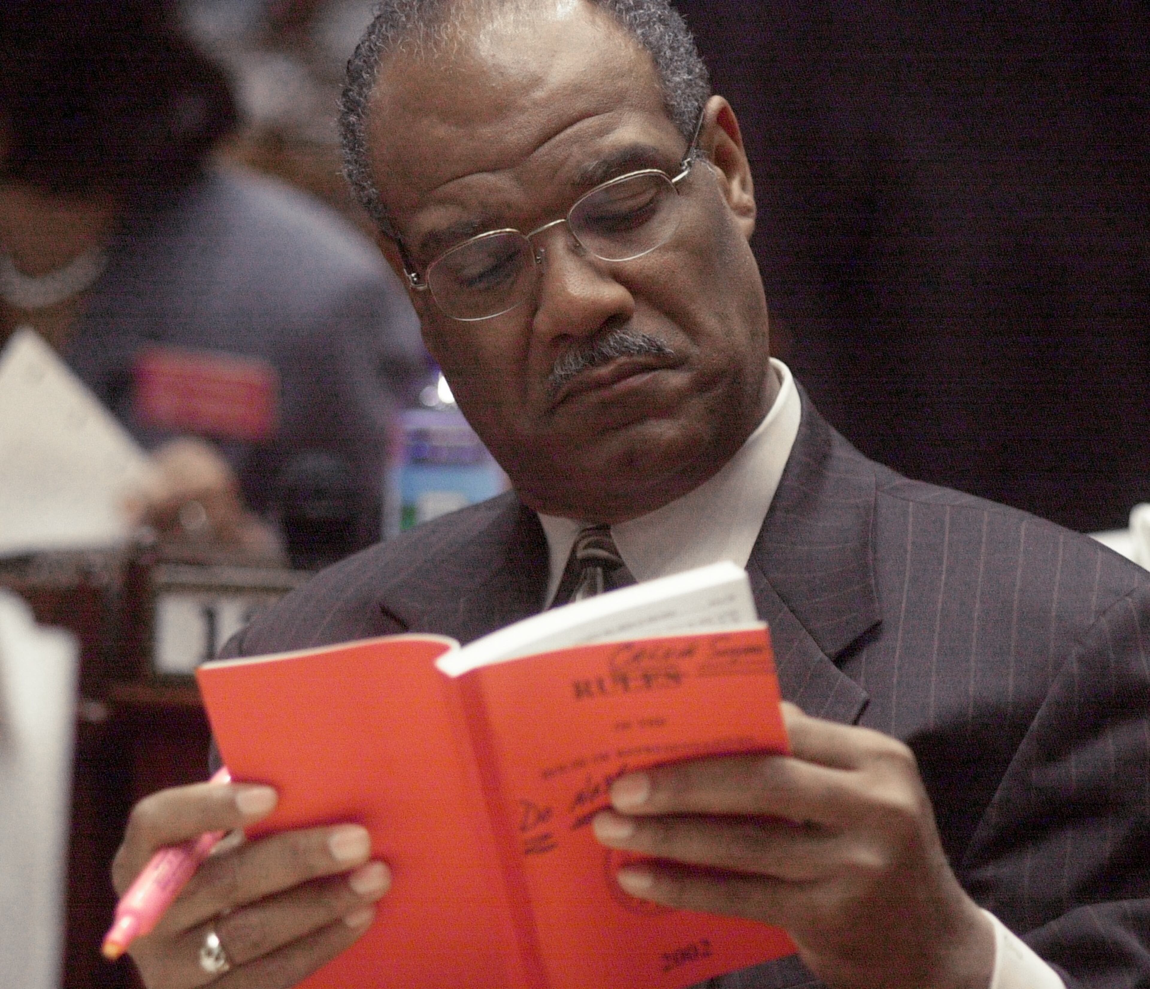 020116 ATLANTA: State Rep. Calvin Smyre (cq) brushes up on do's and don'ts and he reads through the Rules Book Wednesday 1/16/02 as the State House of Representatives met at the Capitol. (Kimberly Smith/staff)