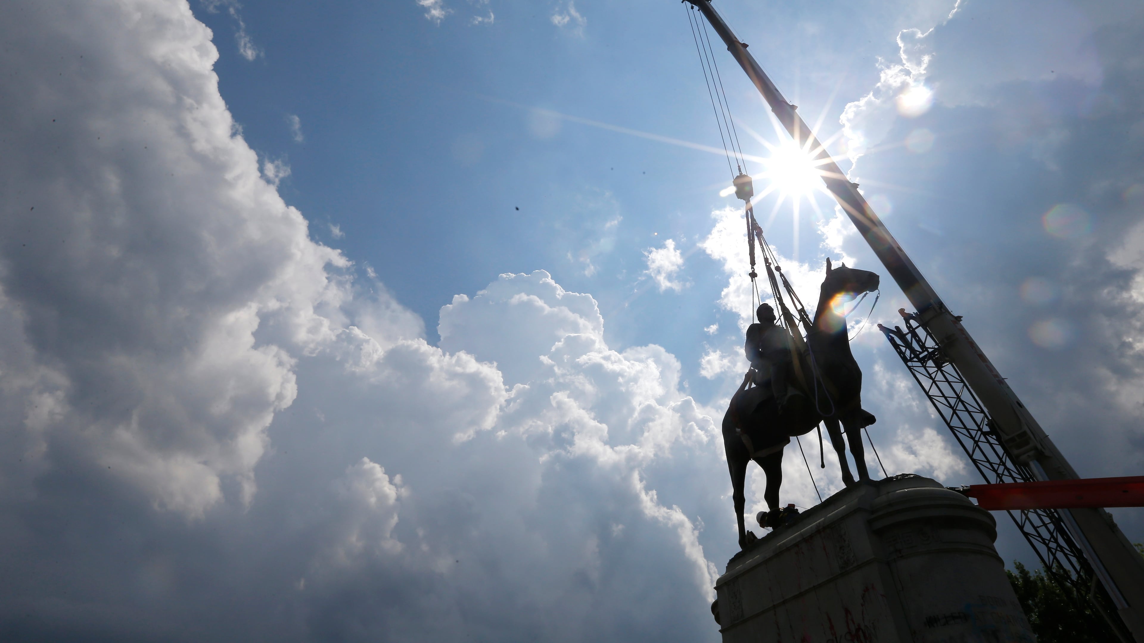 FLE - A crew removes the statue of Confederate Gen. Stonewall Jackson, July 1, 2020, in Richmond, Va. (AP Photo/Steve Helber, File)