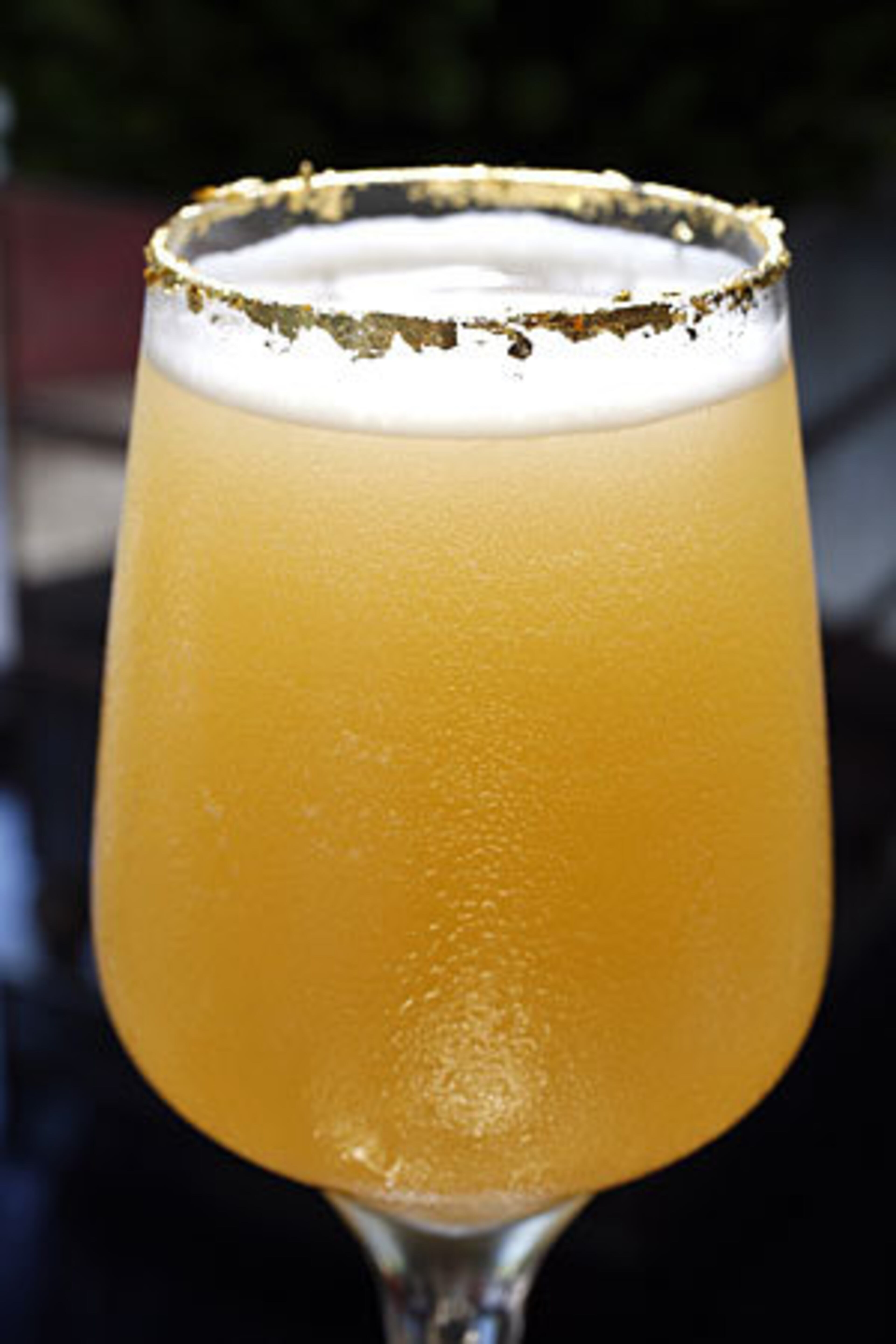 DRINK: Astor Manhattan. HOTEL: St. Regis. INGREDIENTS: St Regis Special Selection Bourbon, Grand Marnier Cinquantenaire, pineapple juice, orgeat and gold flakes.