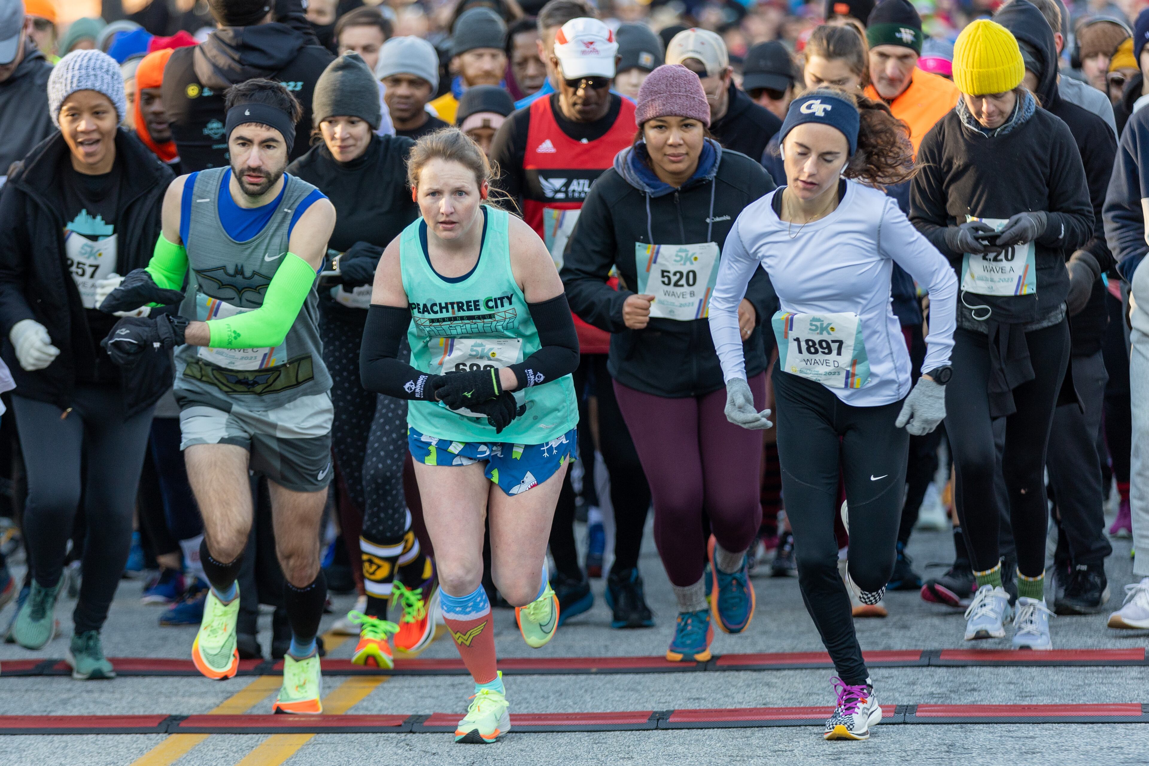 Runners head out at the start of the 20th annual Atlanta Mission 5K Race to End Homelessness on Saturday morning, Feb. 18, 2023. This race is a qualifier for The Atlanta Journal-Constitution Peachtree Road Race. (Photo: Steve Schaefer / steve.schaefer@ajc.com)