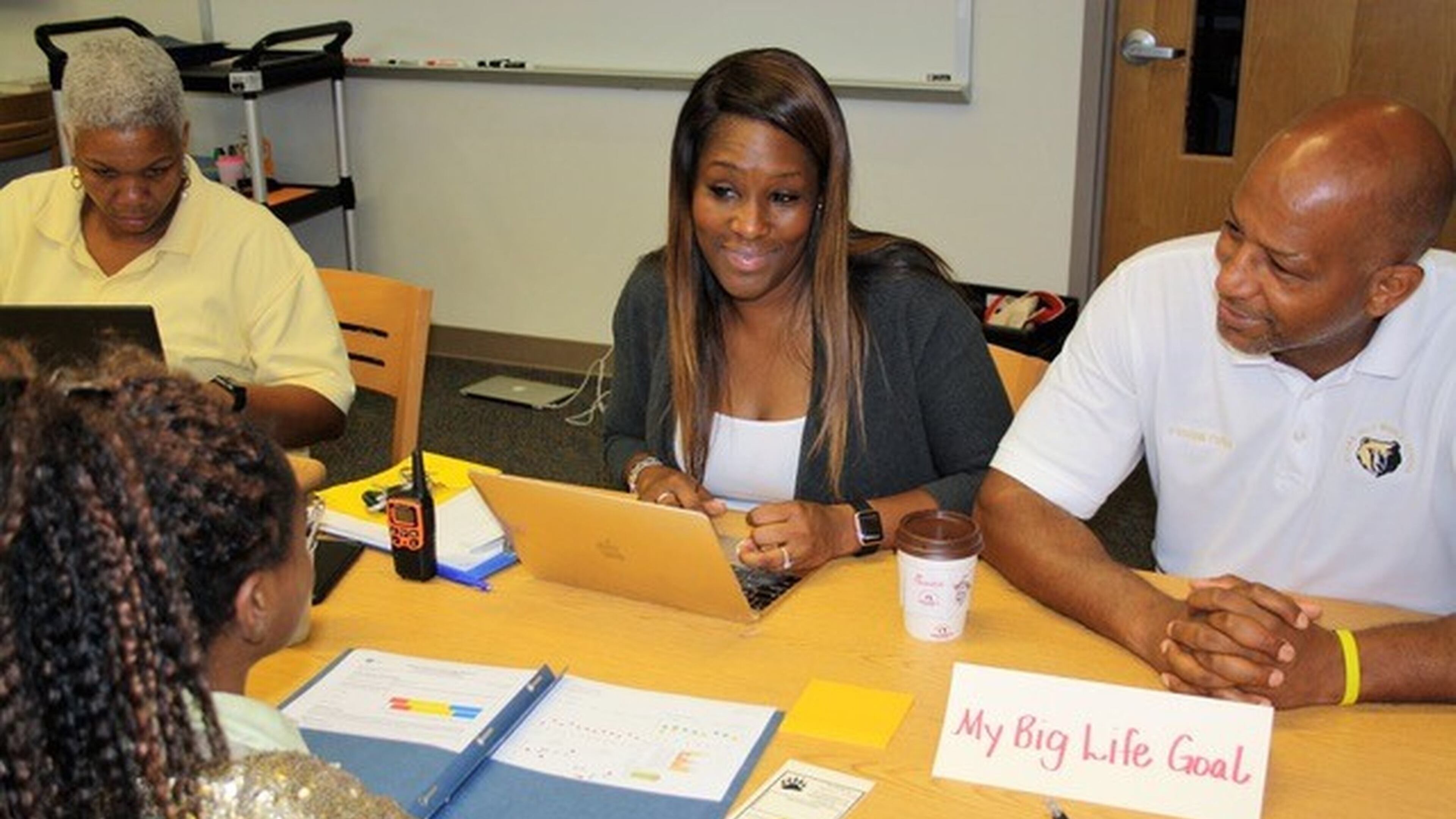 Sylvan Hills Middle School Assistant Principal Monica Blasingame, center, and Principal Artesza Portee, right, discuss big life goals with a student as part of a goal-setting exercise in Atlanta Public Schools. Tara García Mathewson/The Hechinger Report
