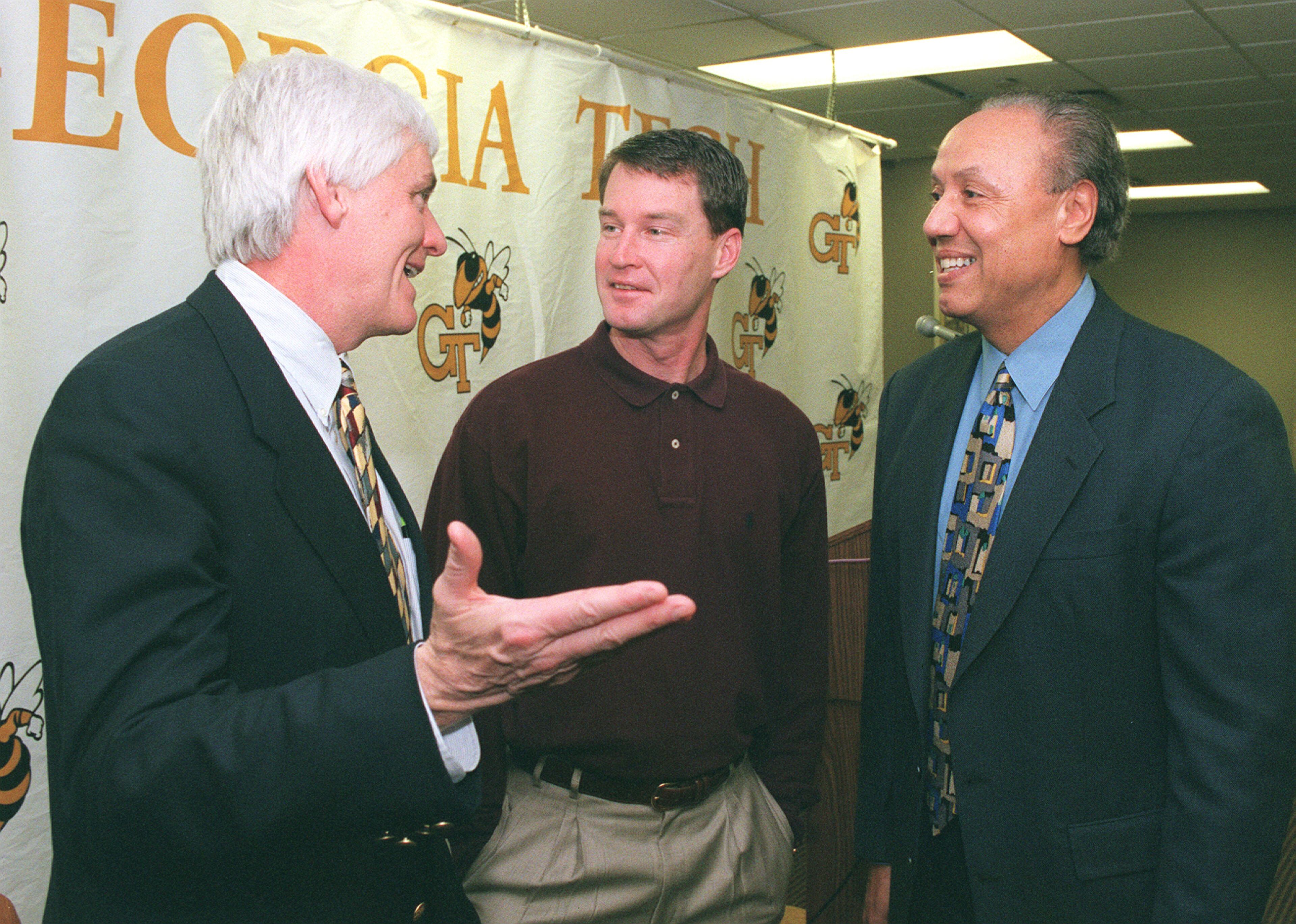 Former Georgia Tech great and NBA veteran Mark Price (middle) chats with his former college coach Bobby Cremins (left) and Lenny Wilkins, one of his former NBA coaches. W.A. BRIDGES JR. / AJC