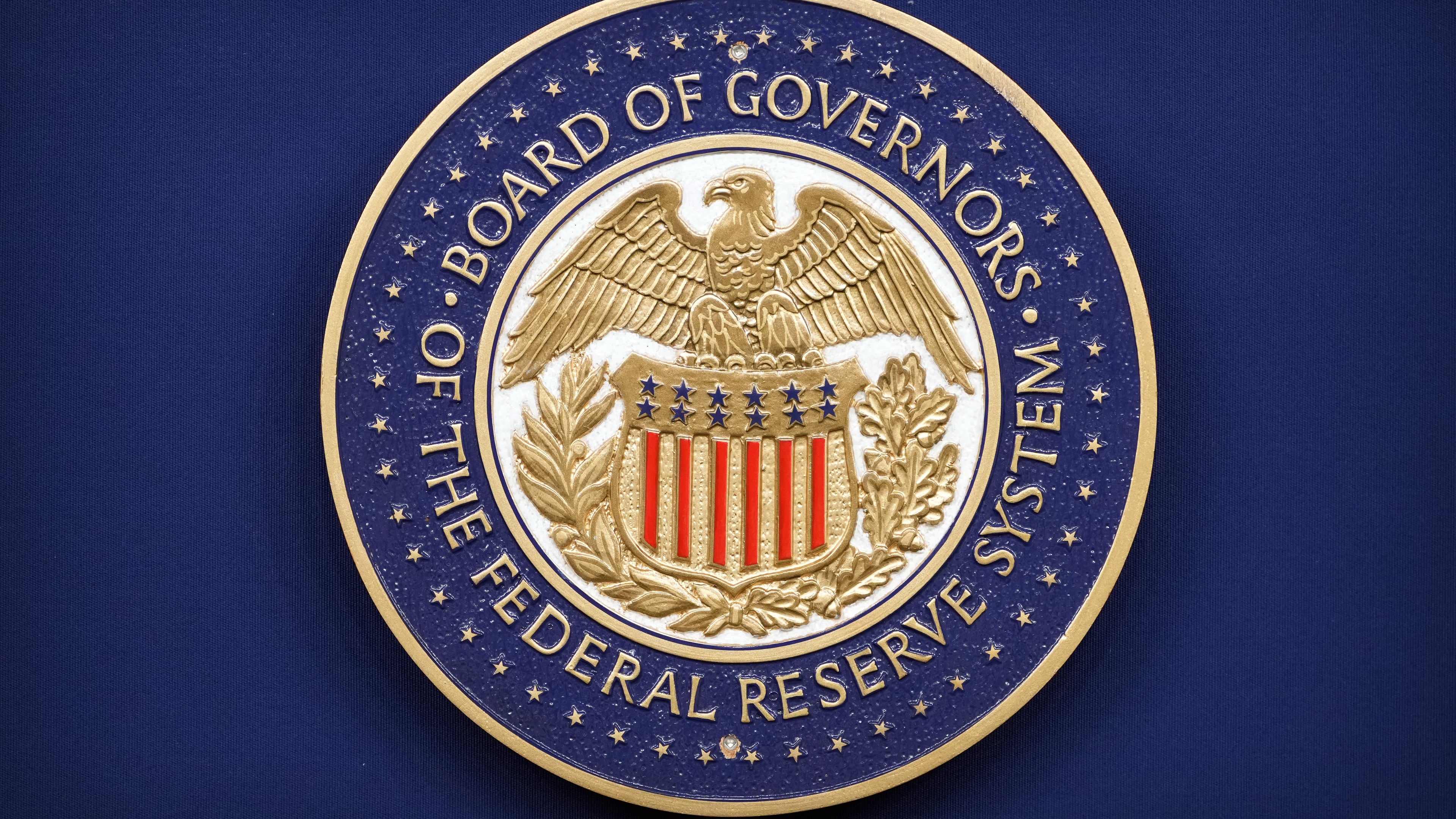 The logo of the Federal Reserve Board of Governors is seen before a news conference with Federal Reserve Board Chairman Kevin Warsh at the Federal Reserve in Washington, Wednesday, July 29, 2026. (AP Photo/Mark Schiefelbein)