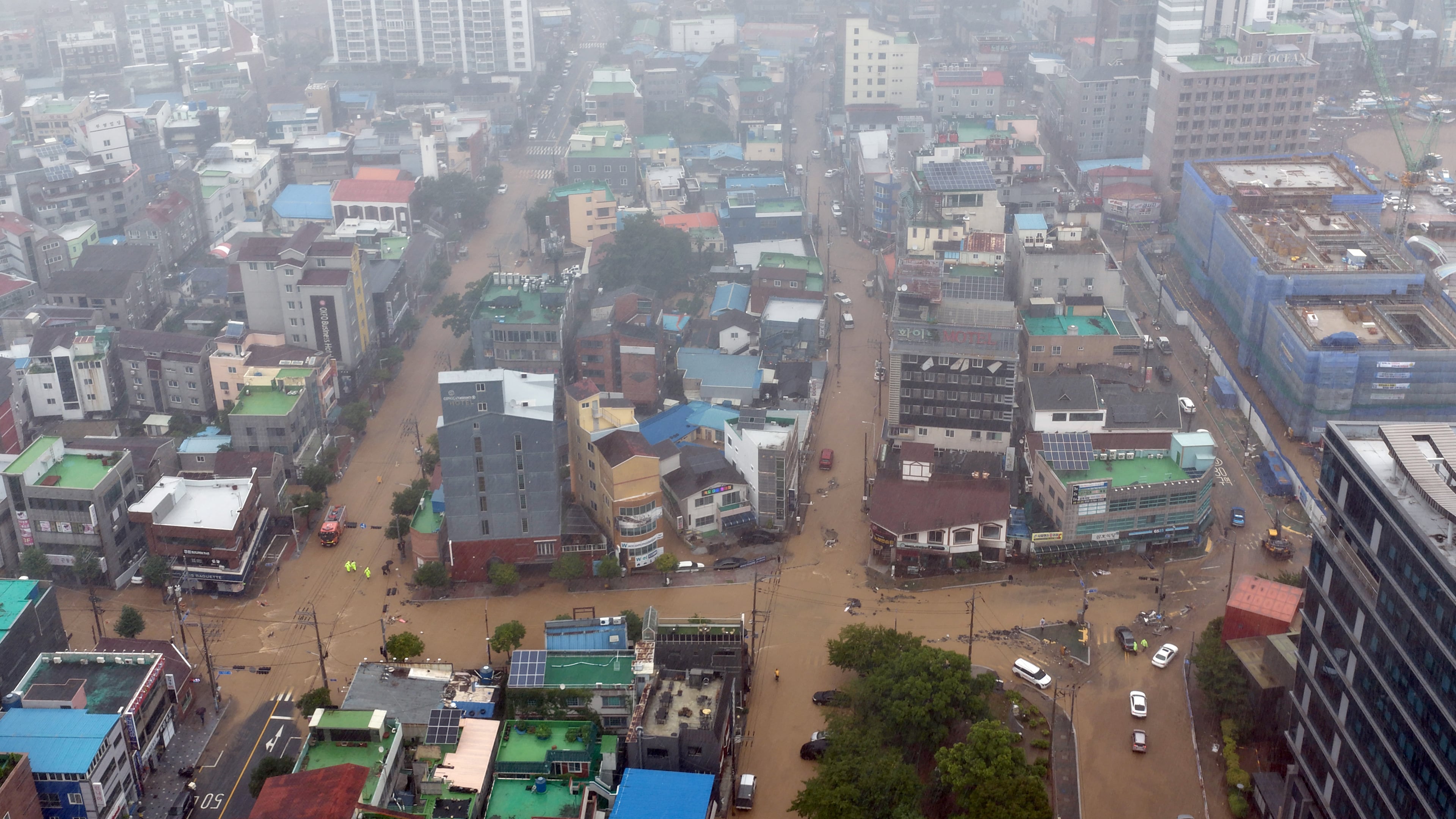 The partly flooded street by heavy rain is seen in Geoje, South Korea, Monday, Aug. 17, 2026. (Kim Dong-min/Yonhap via AP)