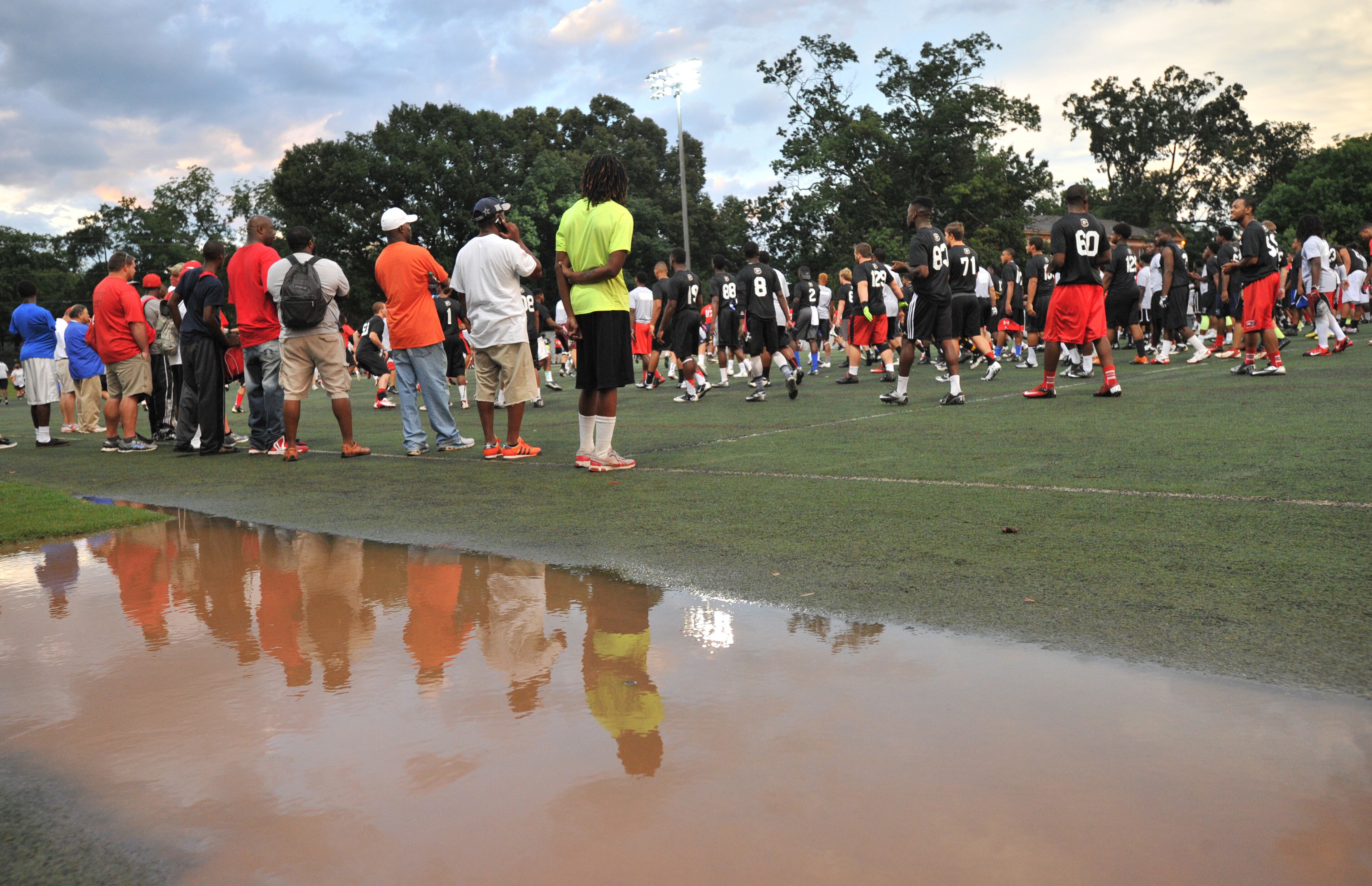 Prospects drill after the rain delay during the annual Dawg Night camp at the Butts-Mehre practice fields in UGA campus in Athens on Friday, July 12, 2013. HYOSUB SHIN / HSHIN@AJC.COM