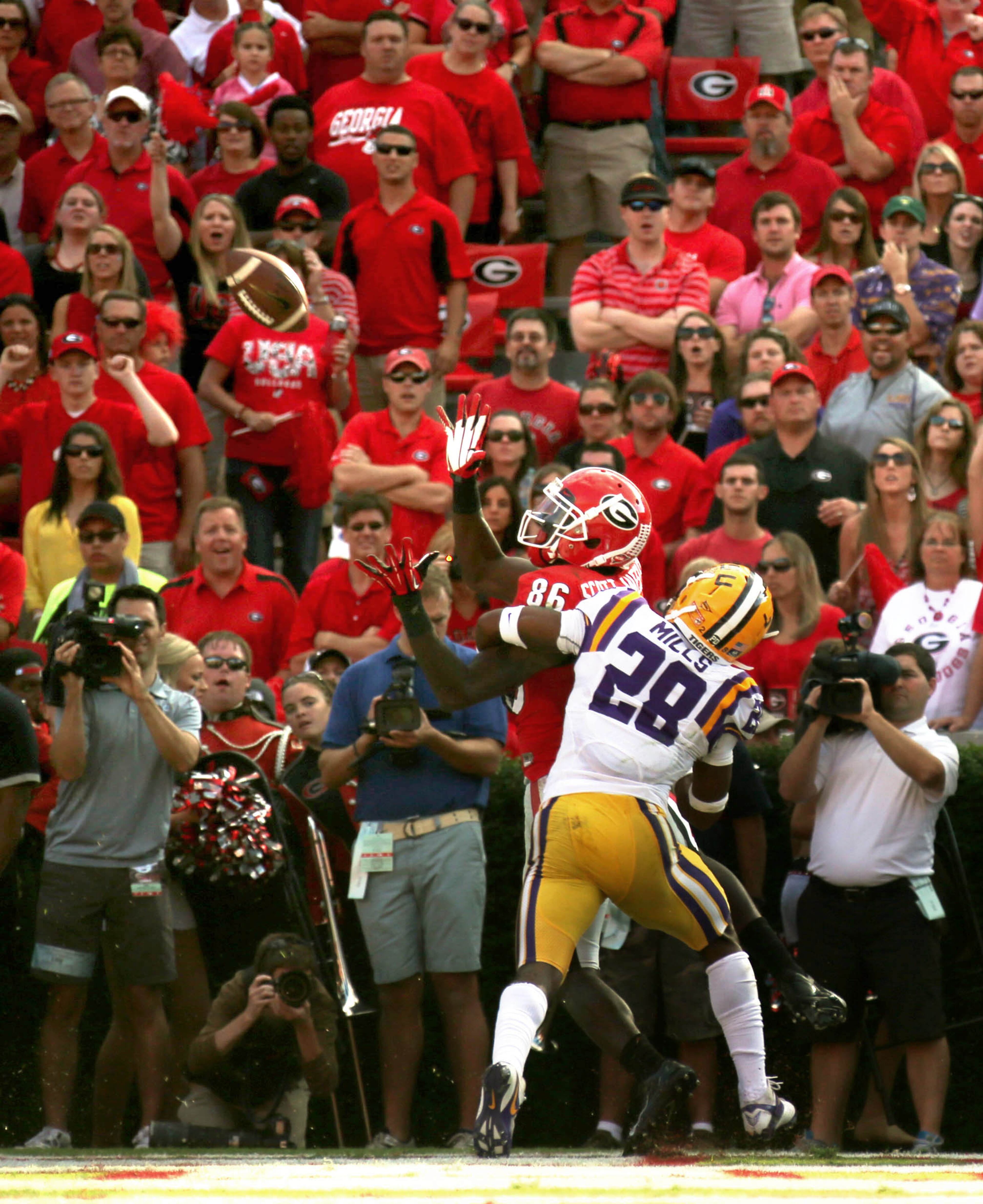 University of Georgia wide receiver Justin Scott-Wesley (86) is interfered by Louisiana State University defensive back Jalen Mills on a penalty in the first half of their game at Sanford Stadium Saturday afternoon in Athens, Ga., September 28, 2013. Georgia would later score on the drive by an Aaron Murray 1 yard touchdown run.