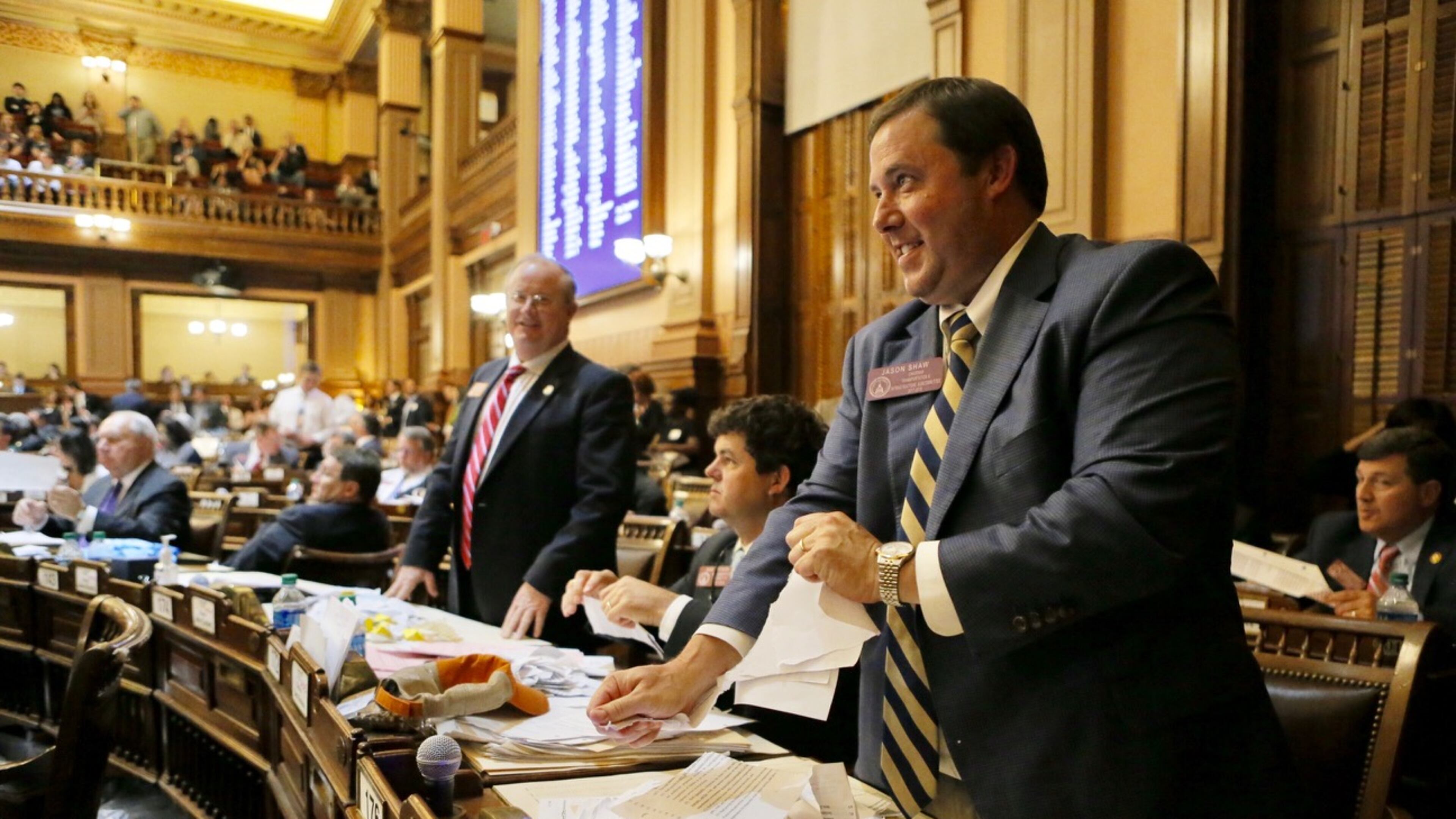 State Rep. Jason Shaw, R-Lakeland, tears up paper to throw when the final gavel fell on the 2017 General Assembly session Friday morning. The photo was taken shortly after the Senate gave final approval to Shaw’s Georgia Agribusiness and Rural Jobs Act. BOB ANDRES /BANDRES@AJC.COM