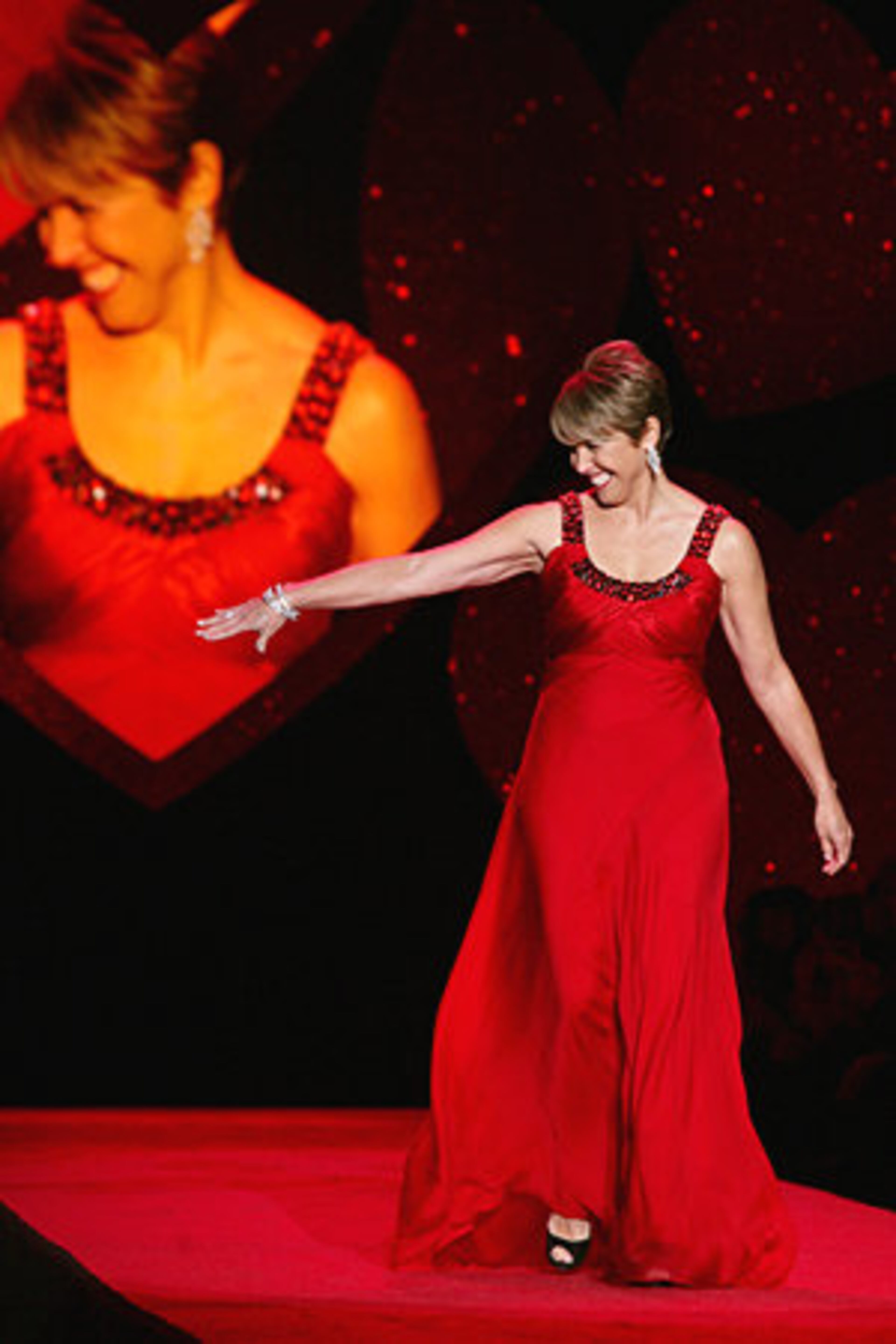 Katie Couric models Carmen Marc Valvo design.