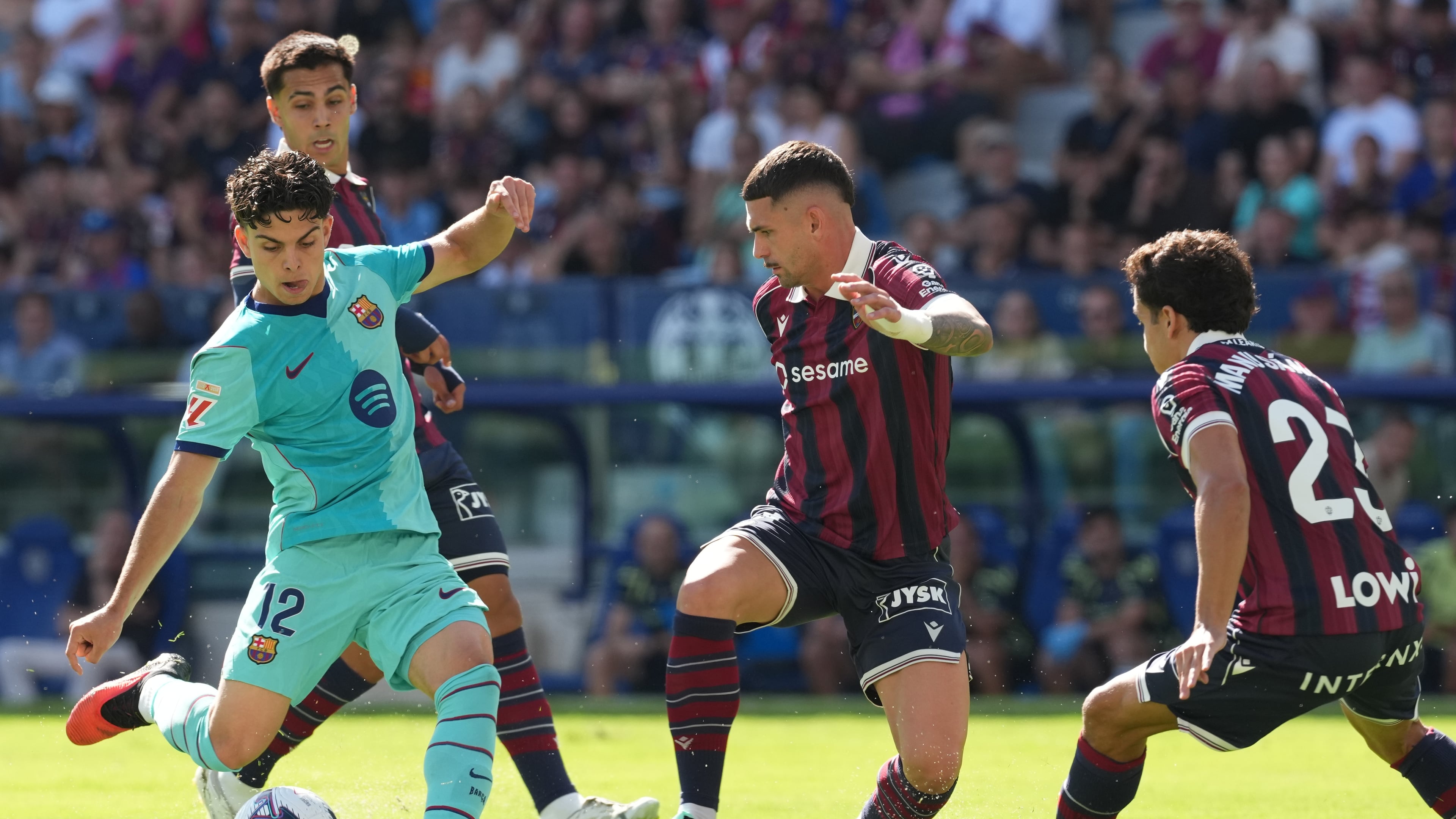 Barcelona's Xavi Espart, left, scores his side's first goal during the Spanish La Liga soccer match between Levante and Barcelona in Valencia, Sunday, Sept. 13, 2026. (AP Photo/Alberto Saiz)