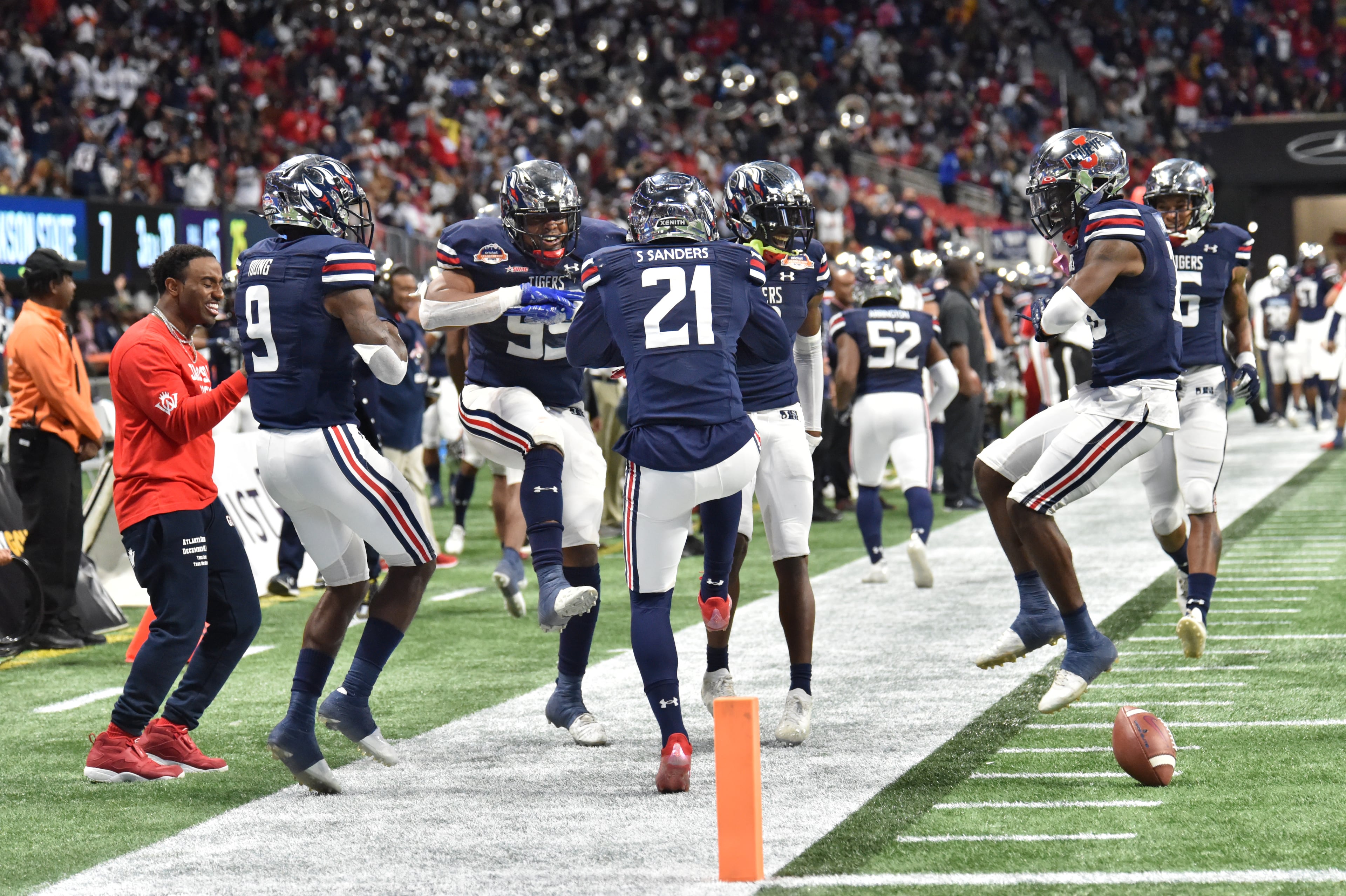 Jackson State's defensive back Shilo Sanders (21) and teammates celebrate after Sanders intercepted a pass during the first half of the 2021 Cricket Celebration Bowl at Mercedes-Benz Stadium in Atlanta on Saturday, December 18, 2021. (Hyosub Shin / Hyosub.Shin@ajc.com)