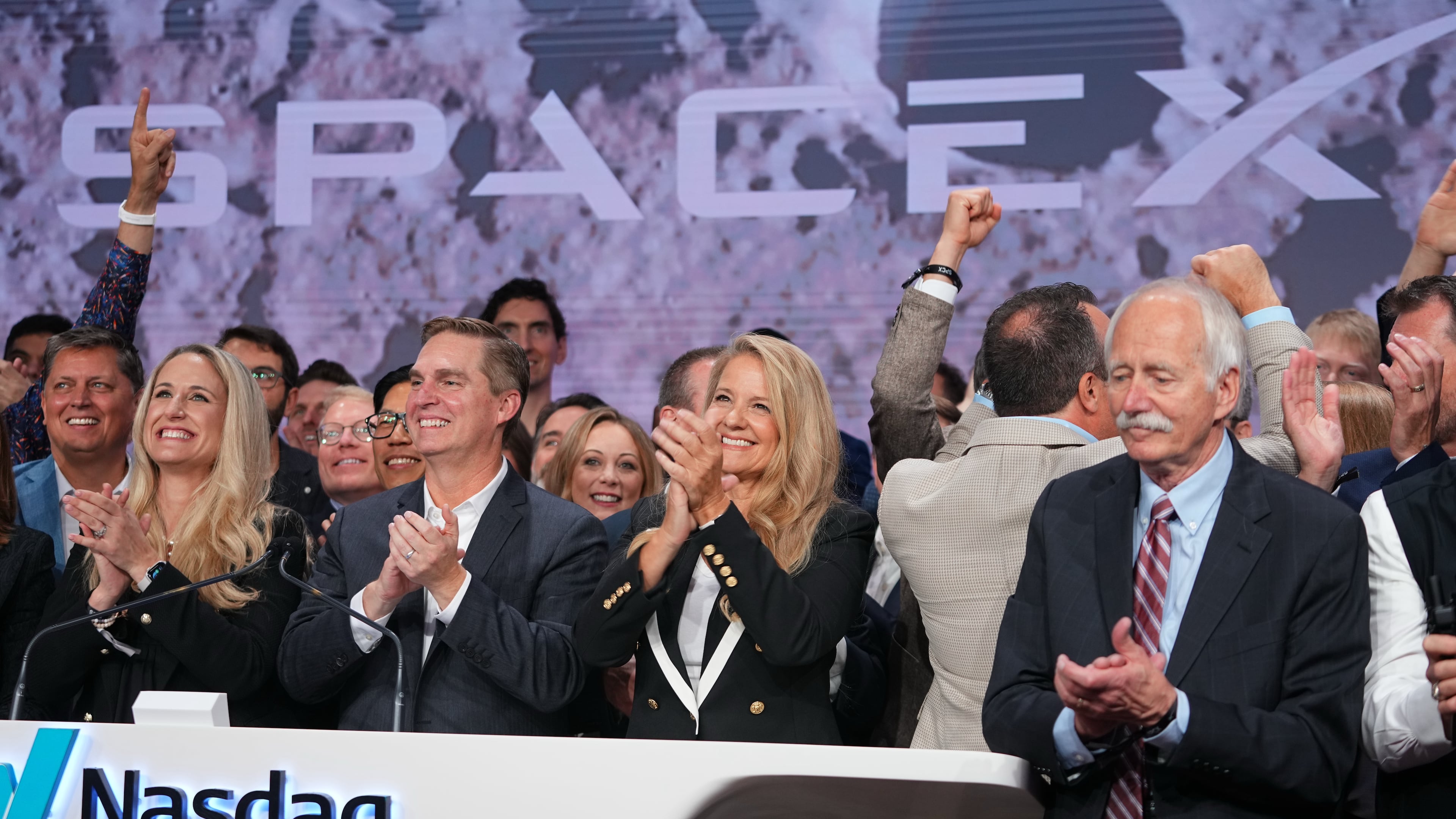 Gwynne Shotwell, President and COO of SpaceX celebrates with colleagues during a bell ringing ceremony for the IPO of SpaceX at the Nasdaq MarketSite in New York, Friday, June 12, 2026, in New York. (AP Photo/Frank Franklin II)