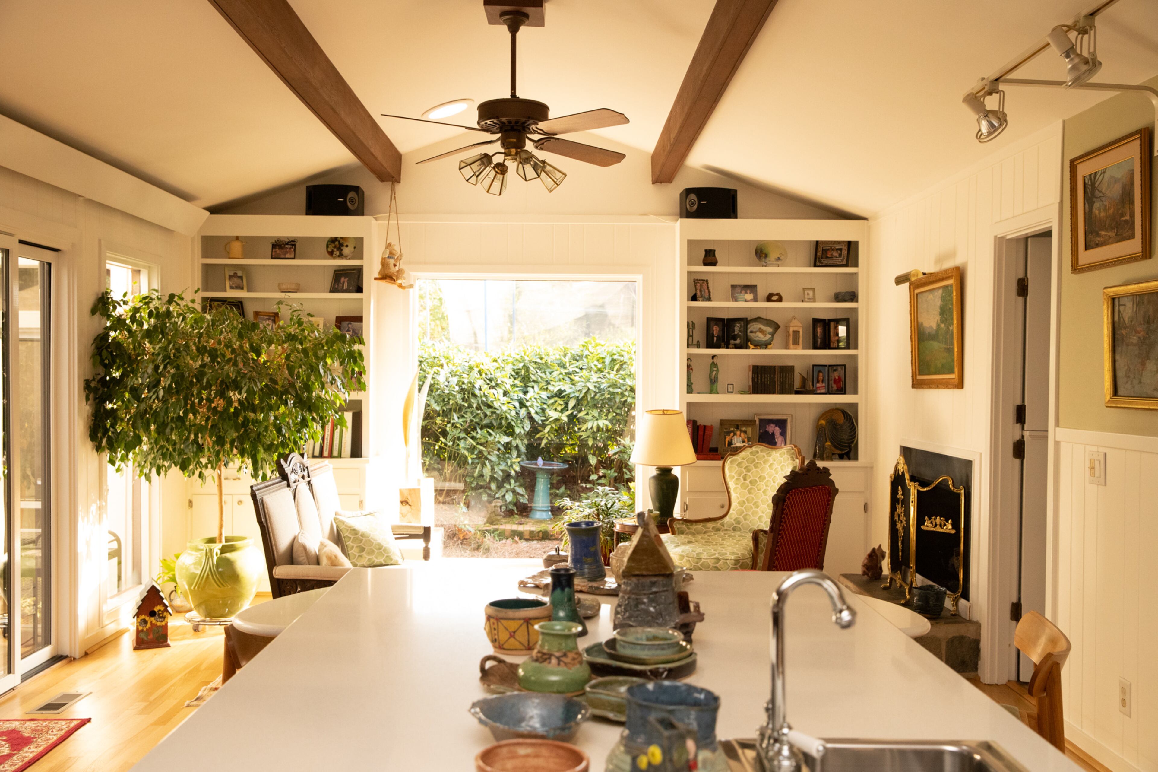 One of the main ways Jan Heck tried to bring an airiness to the home is by incorporating many expansive windows. The window in the family room in particular is one Heck states completes the whole room, and makes her feel like she’s outside. She says she’ll sometimes sit in one of the couches or chairs, and watch the animals running around the yard. Text by Megan Wahn/Photo by Reynolds Rogers