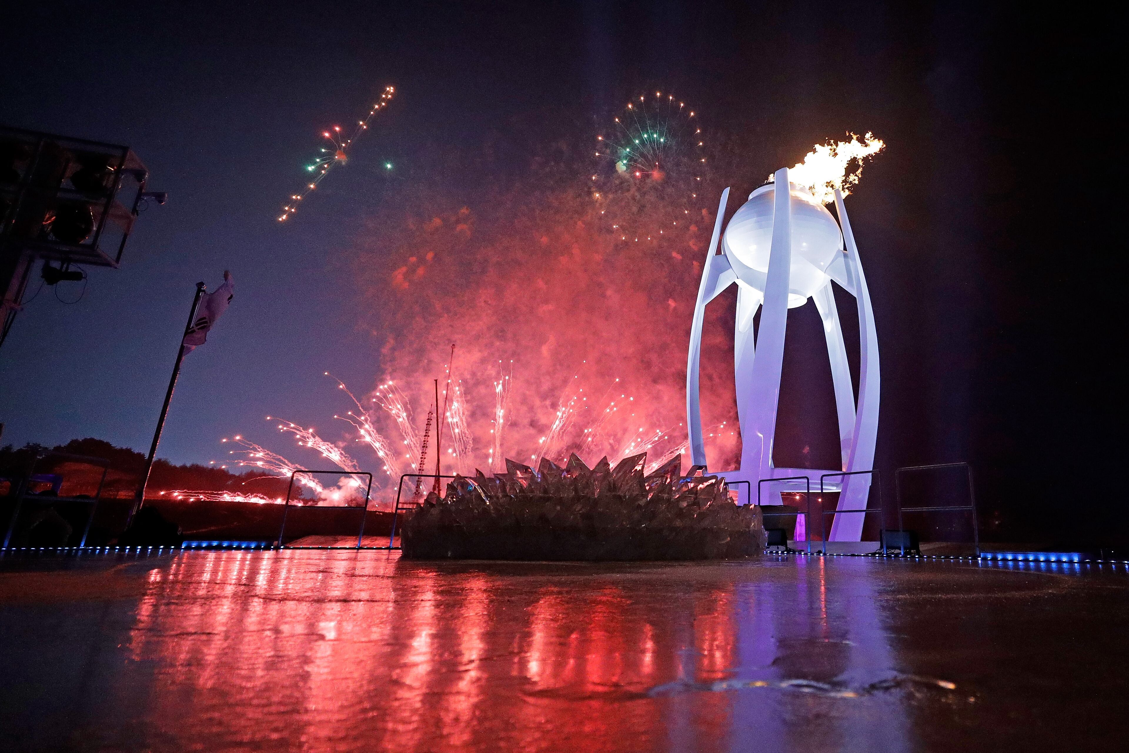 PYEONGCHANG-GUN, SOUTH KOREA - FEBRUARY 09: Fireworks erupt as the Olympic Cauldron is lit during the Opening Ceremony of the PyeongChang 2018 Winter Olympic Games at PyeongChang Olympic Stadium on February 9, 2018 in Pyeongchang-gun, South Korea. (Photo by Pool - David J. Phillip/Getty Images)