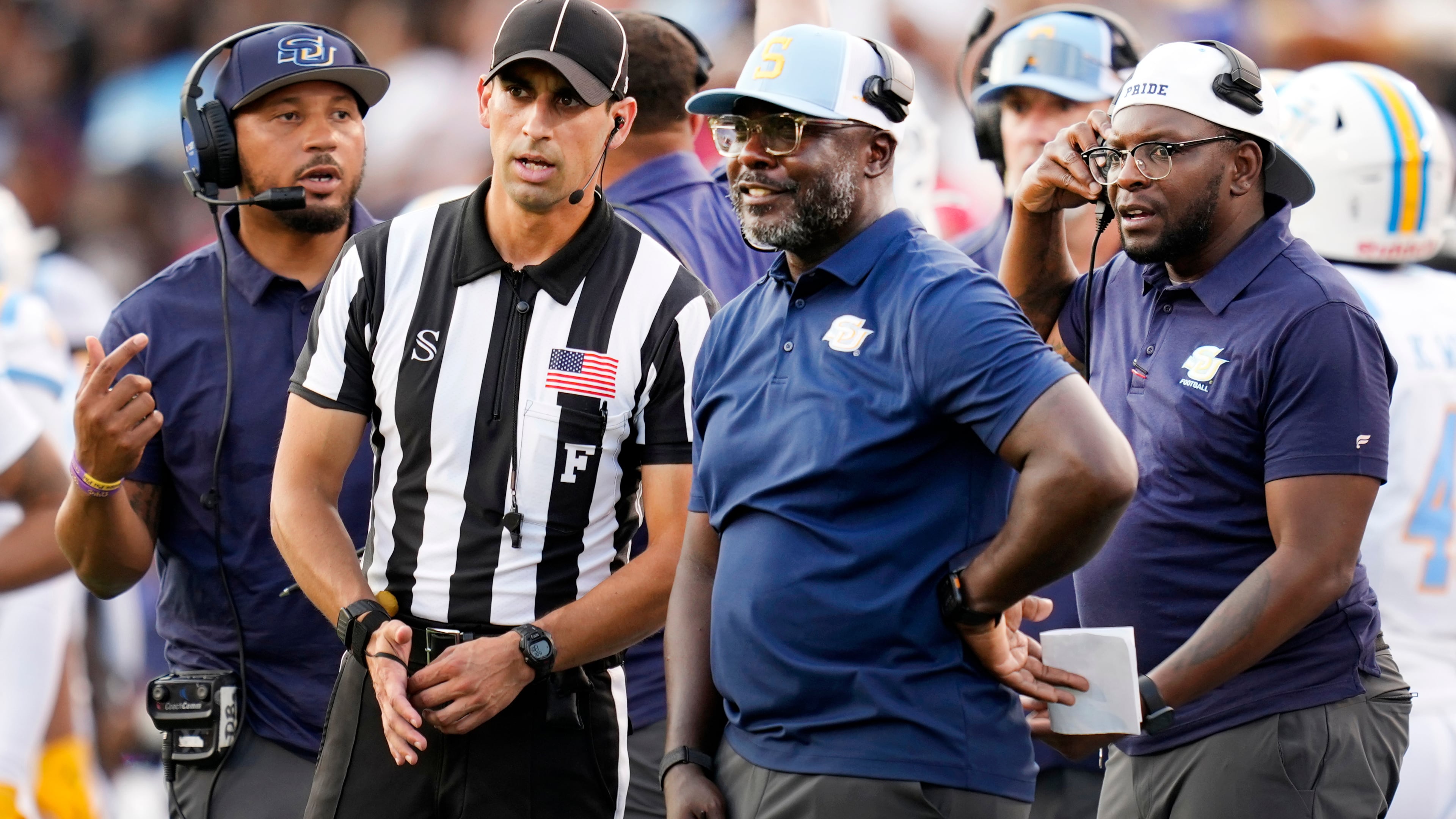 FILE - Southern head coach Marshall Faulk, center right, talks with an official during the first half of an NCAA college football game against Houston in Houston, Saturday, Sept. 12, 2026. (AP Photo/Ashley Landis,File)