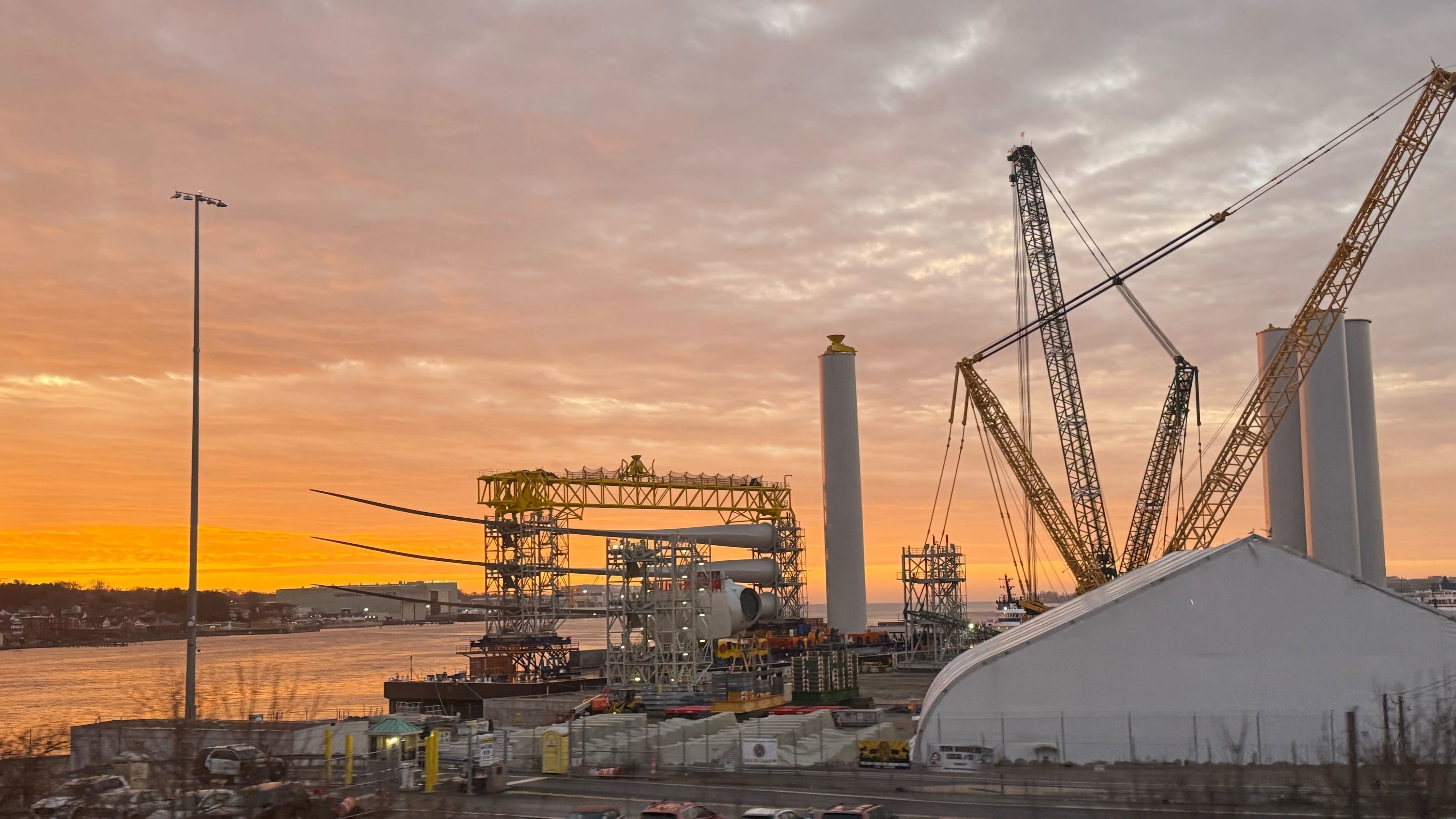 FILE - Blades and turbine bases for offshore wind sit at a staging area at New London State Pier, Jan. 14, 2026, in New London, Conn. (AP Photo/Matt O'Brien, File)