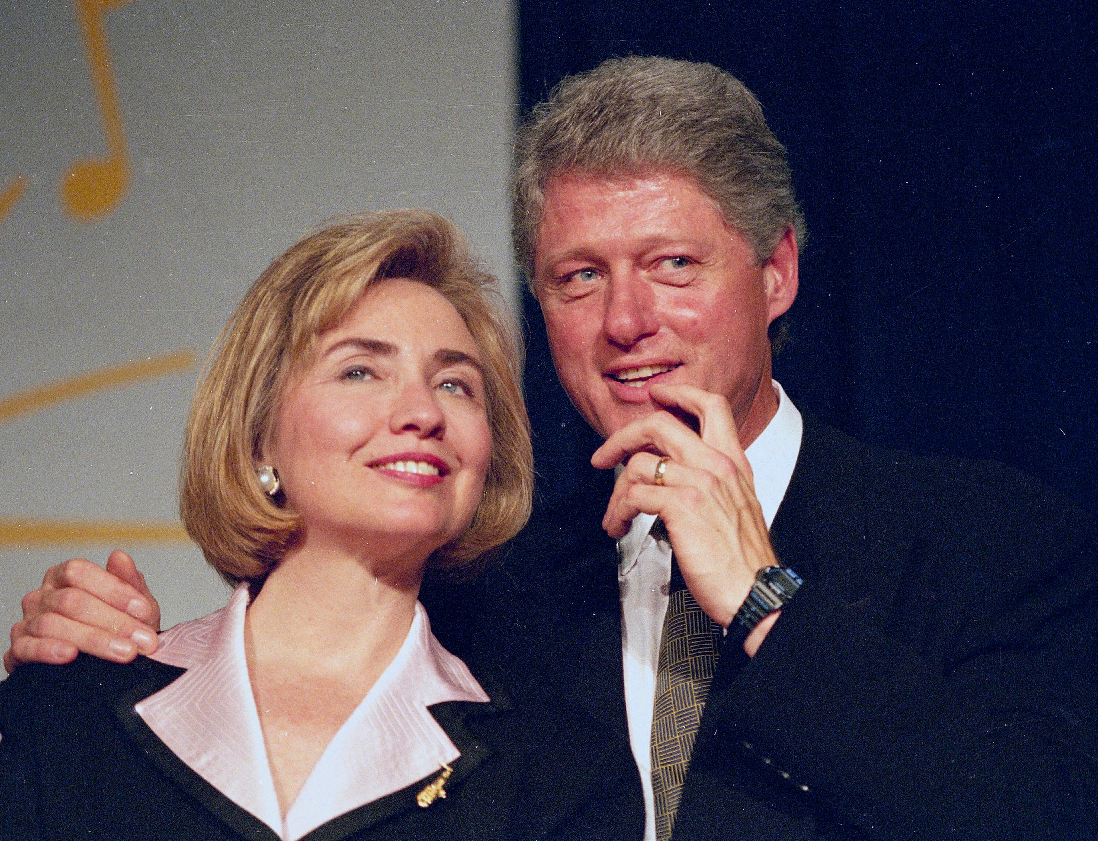 In this June 22, 1994 file photo, President Bill Clinton and first lady Hillary Clinton wait to address a group of young Democratic supporters known as the Saxophone Club in Washington. (AP Photo/J. Scott Applewhite)