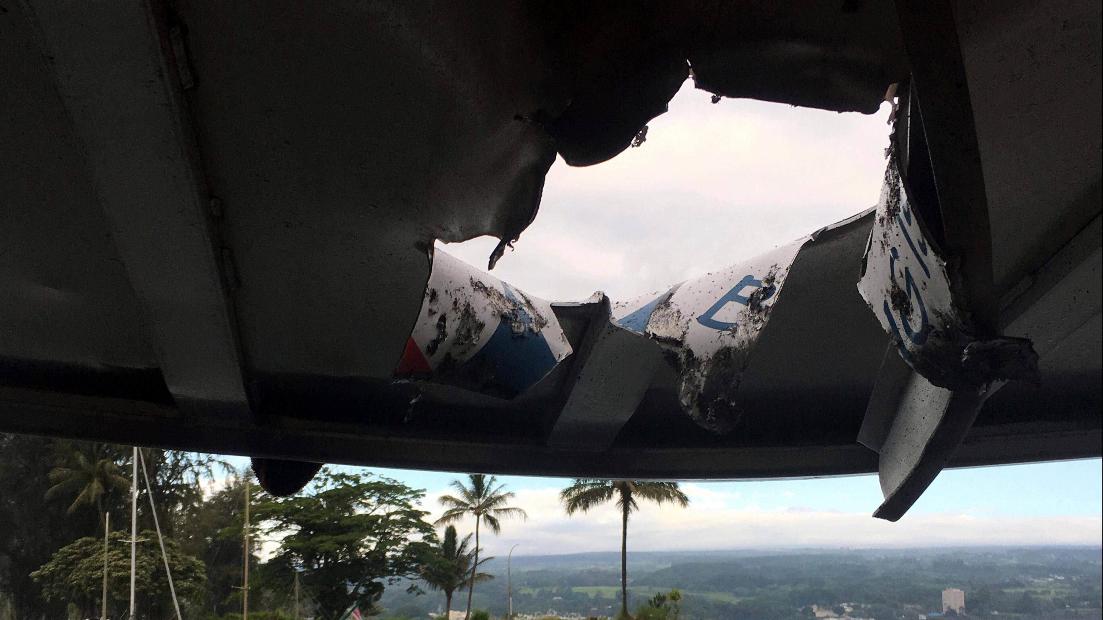 This photo provided by the Hawaii Department of Land and Natural Resources shows damage to the roof of a tour boat after an explosion sent lava flying through the roof off the Big Island of Hawaii Monday, July 16, 2018, injuring at least 23 people. The lava came from the Kilauea volcano, which has been erupting from a rural residential area since early May.